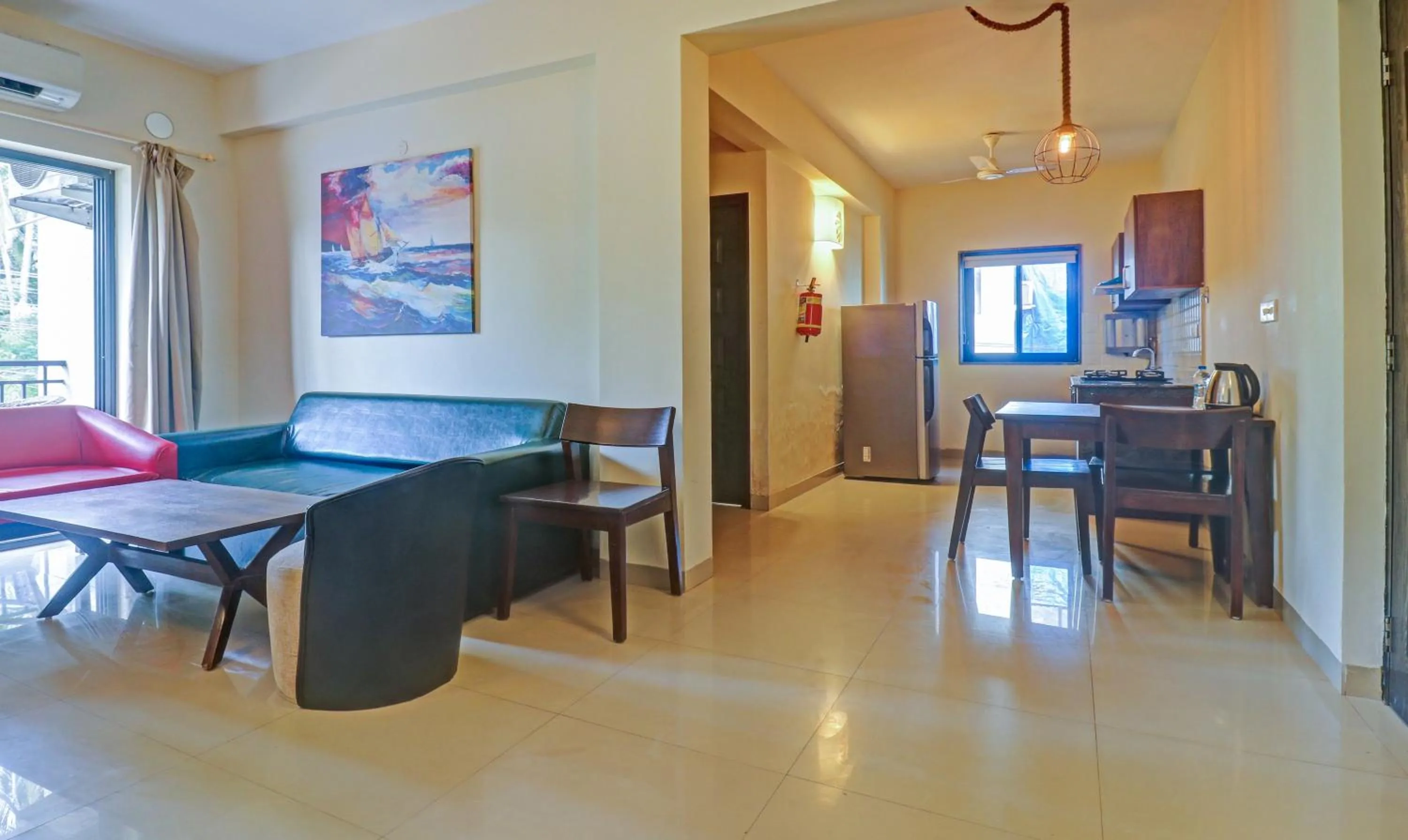 Seating area in Treebo Aquamarine Arpora With Pool