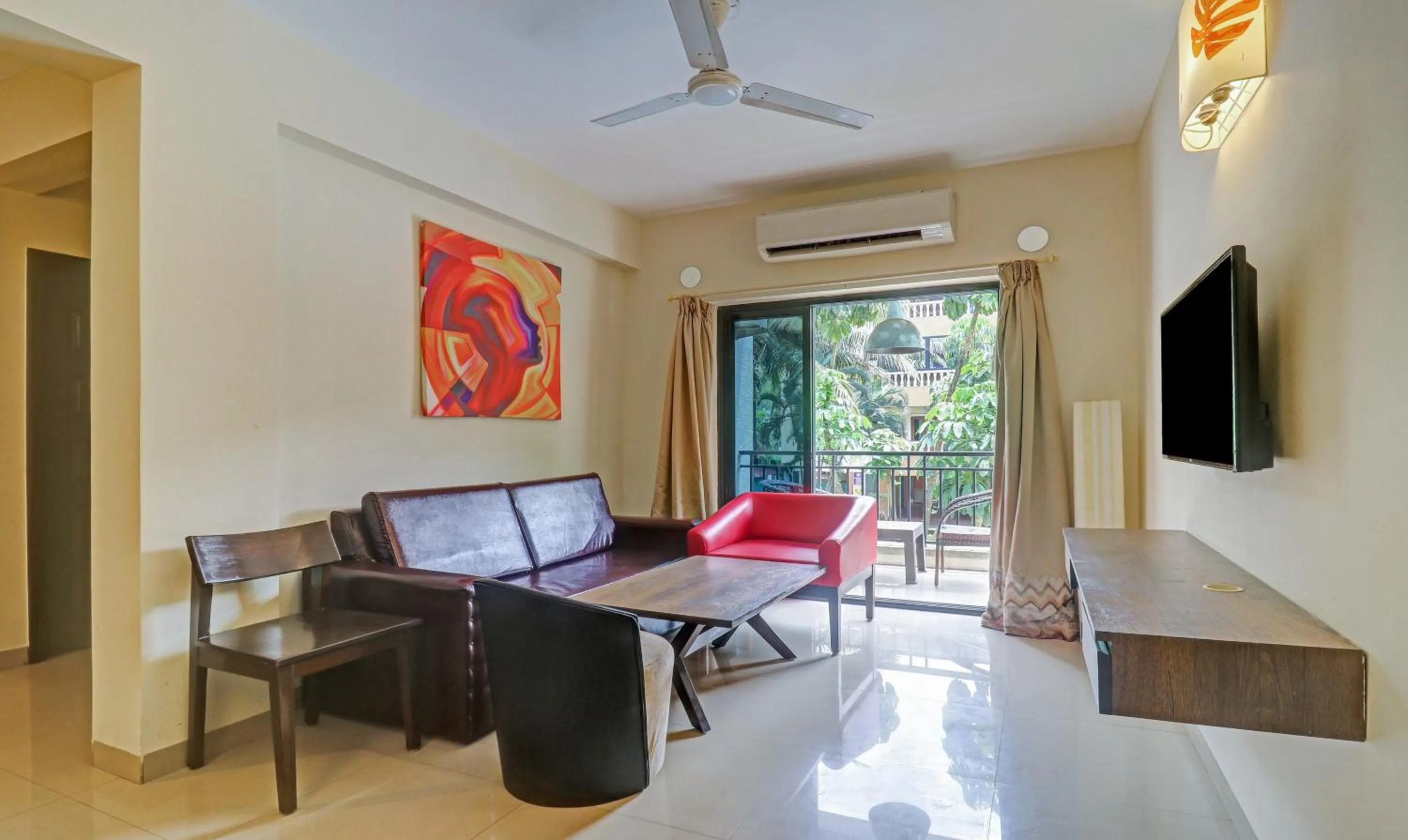 Seating area in Treebo Aquamarine Arpora With Pool