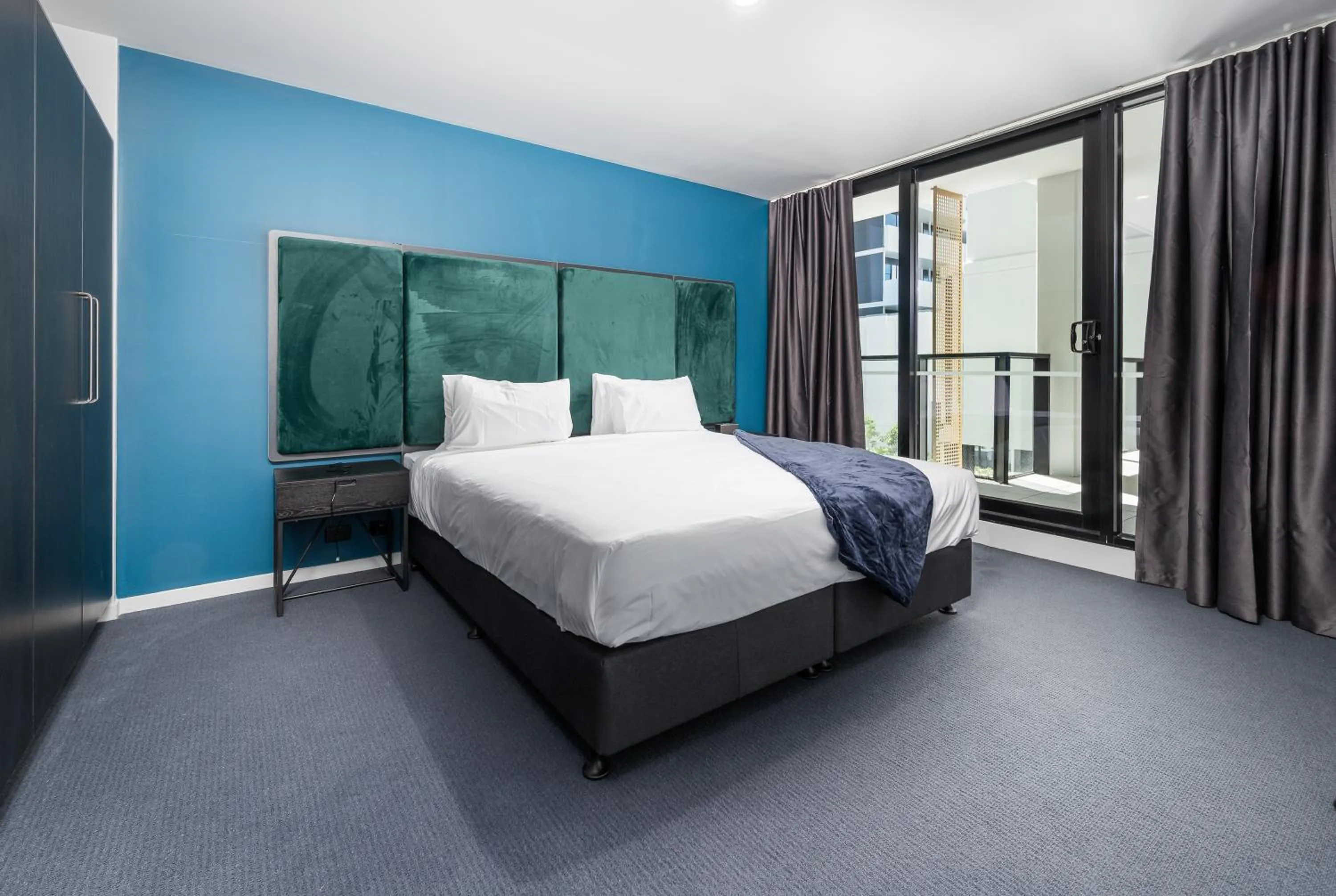 Bed in Oros Hotel and Apartments