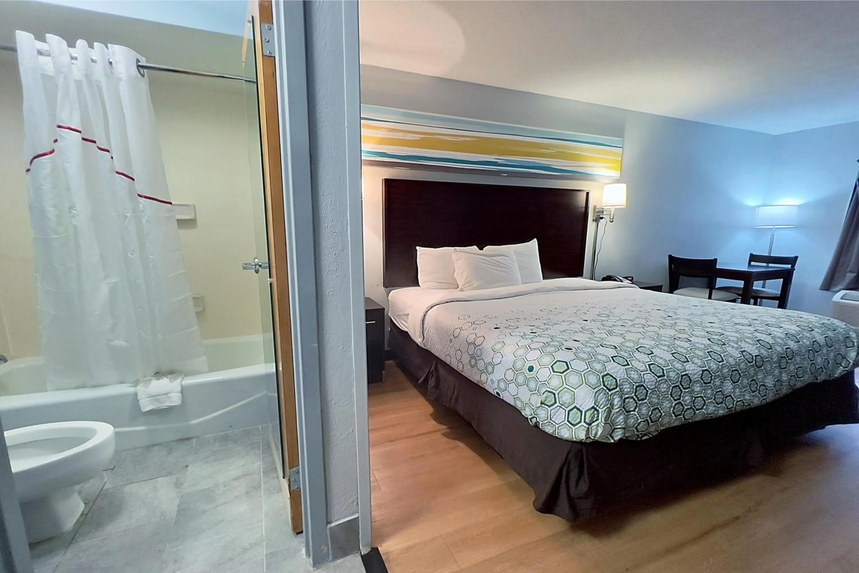 Bed in HomeTowne Studios by Red Roof Augusta