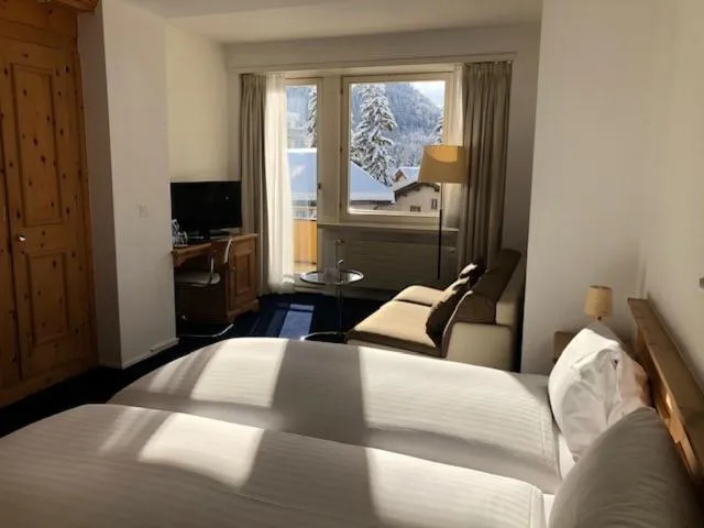 Mountain view, Bed in Hotel Schweizerhof Pontresina