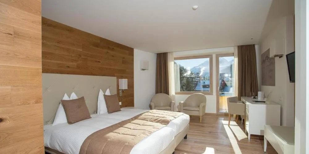 Bed in Hotel Schweizerhof Pontresina