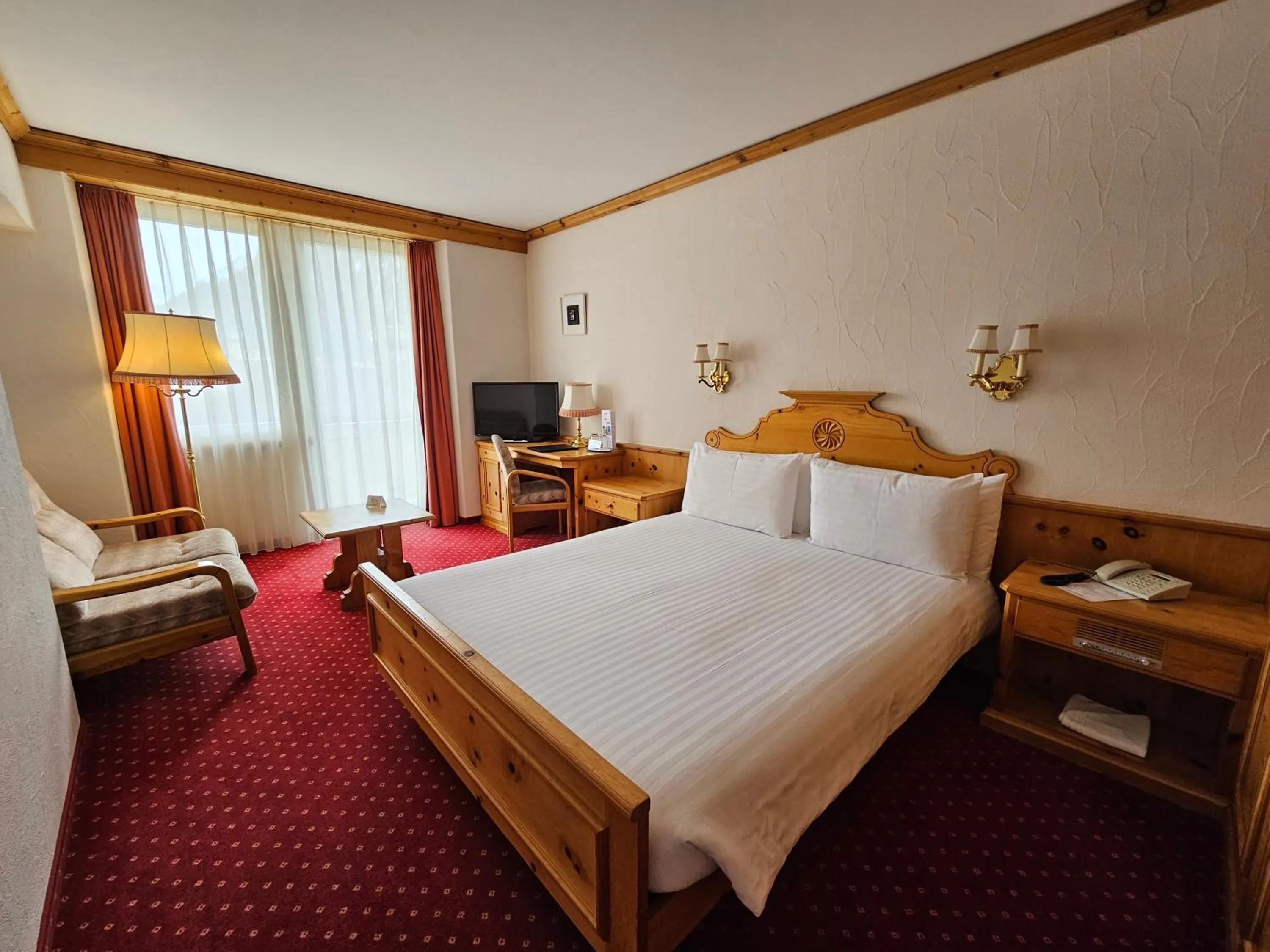 Bed in Hotel Schweizerhof Pontresina