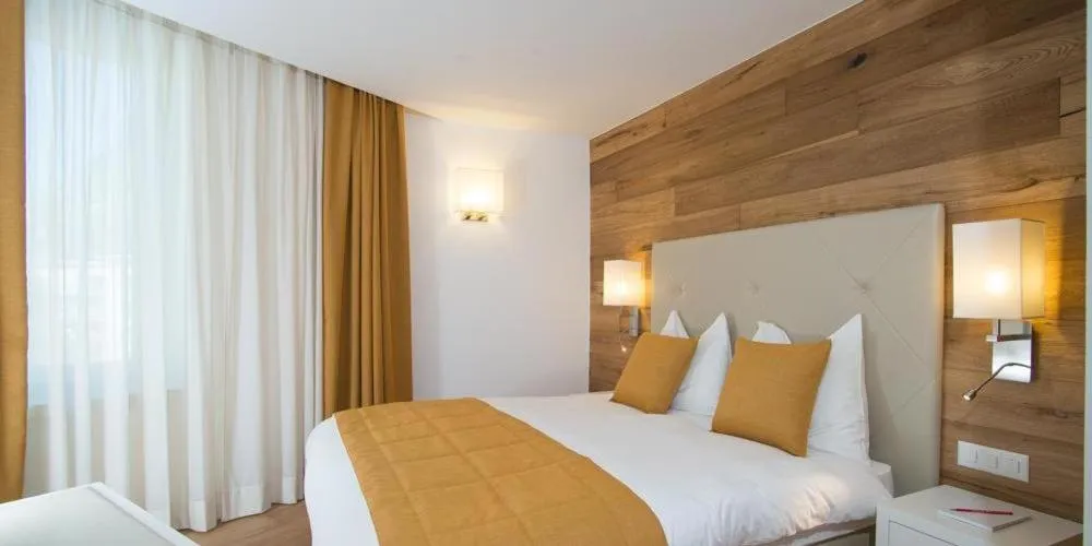 Bed in Hotel Schweizerhof Pontresina