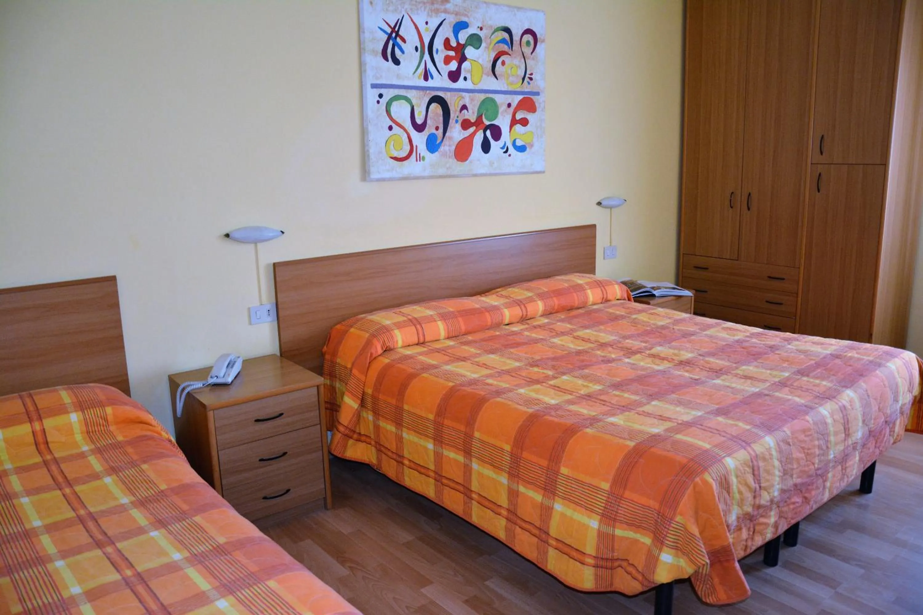 Bed in Piccolo Hotel