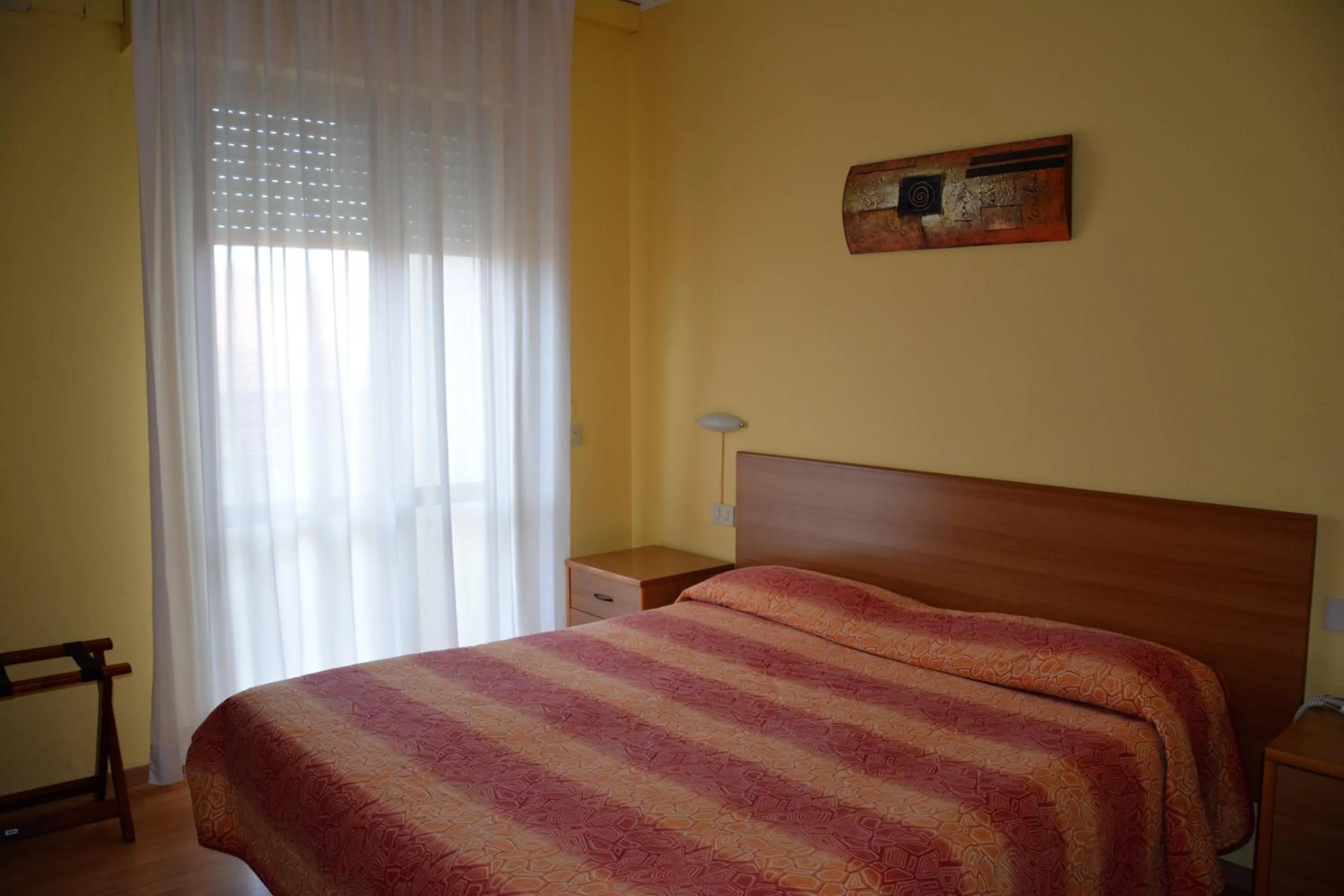 Bed in Piccolo Hotel