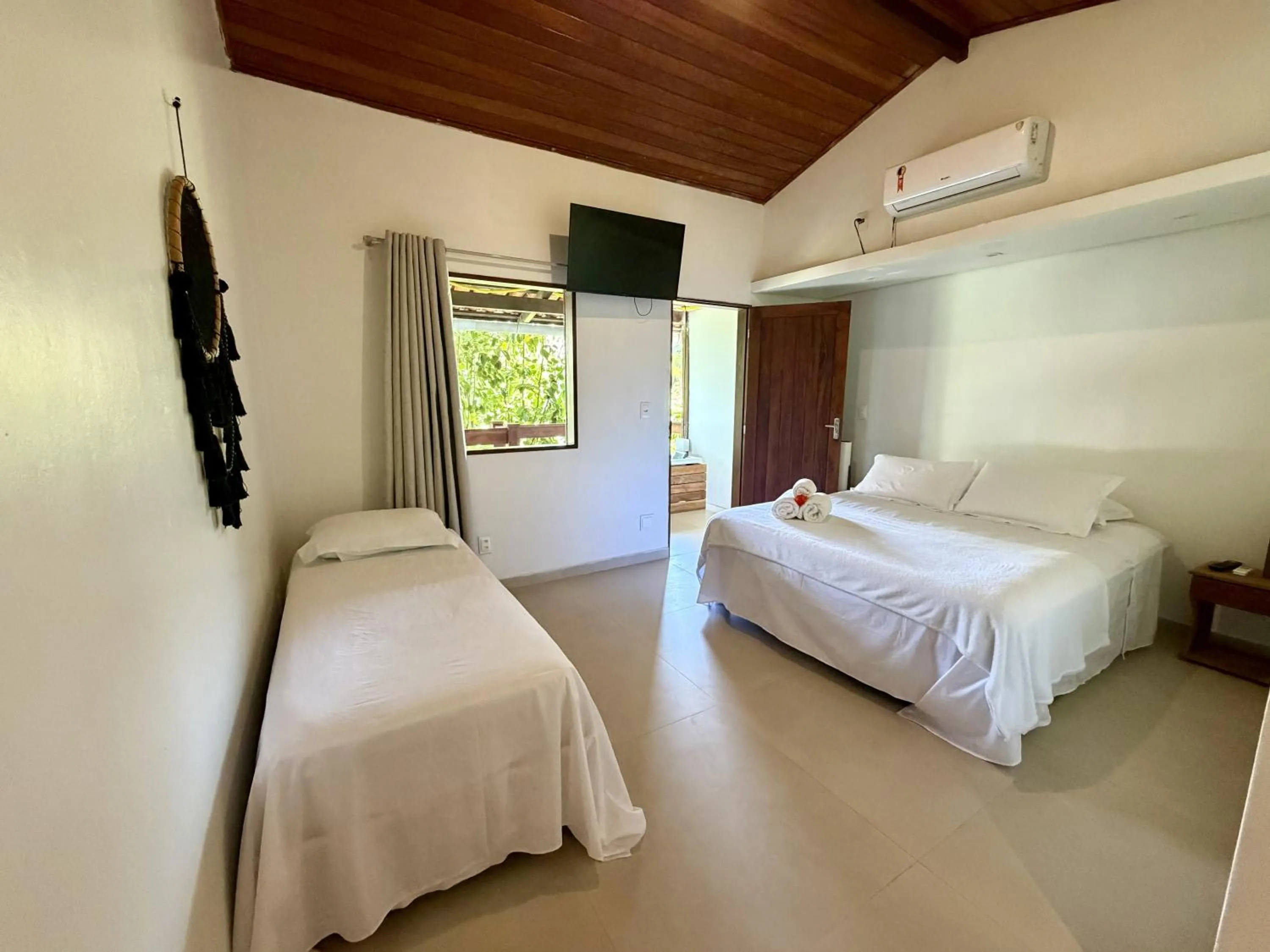 Bed in Chez Max Pousada