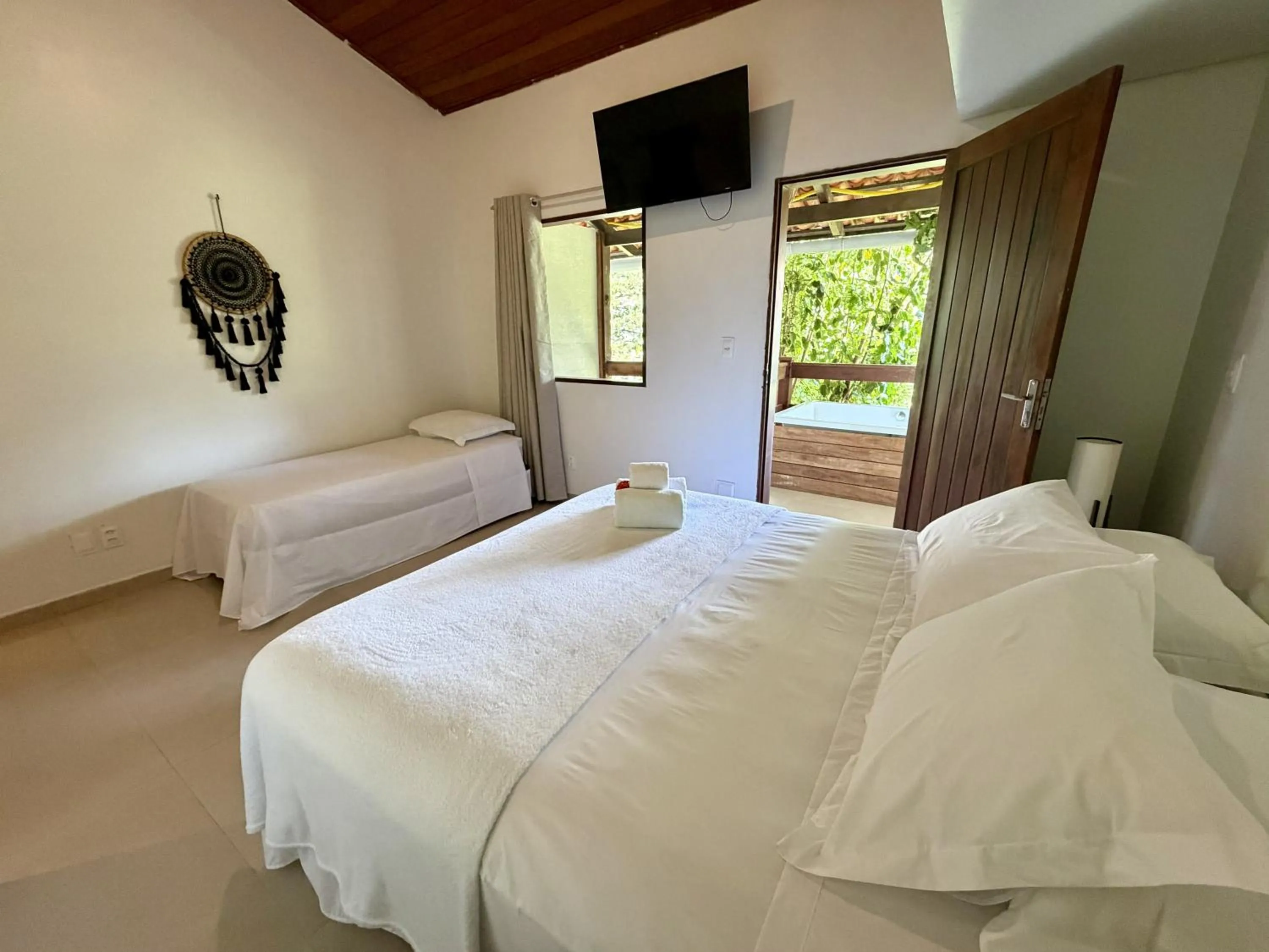 Bed in Chez Max Pousada