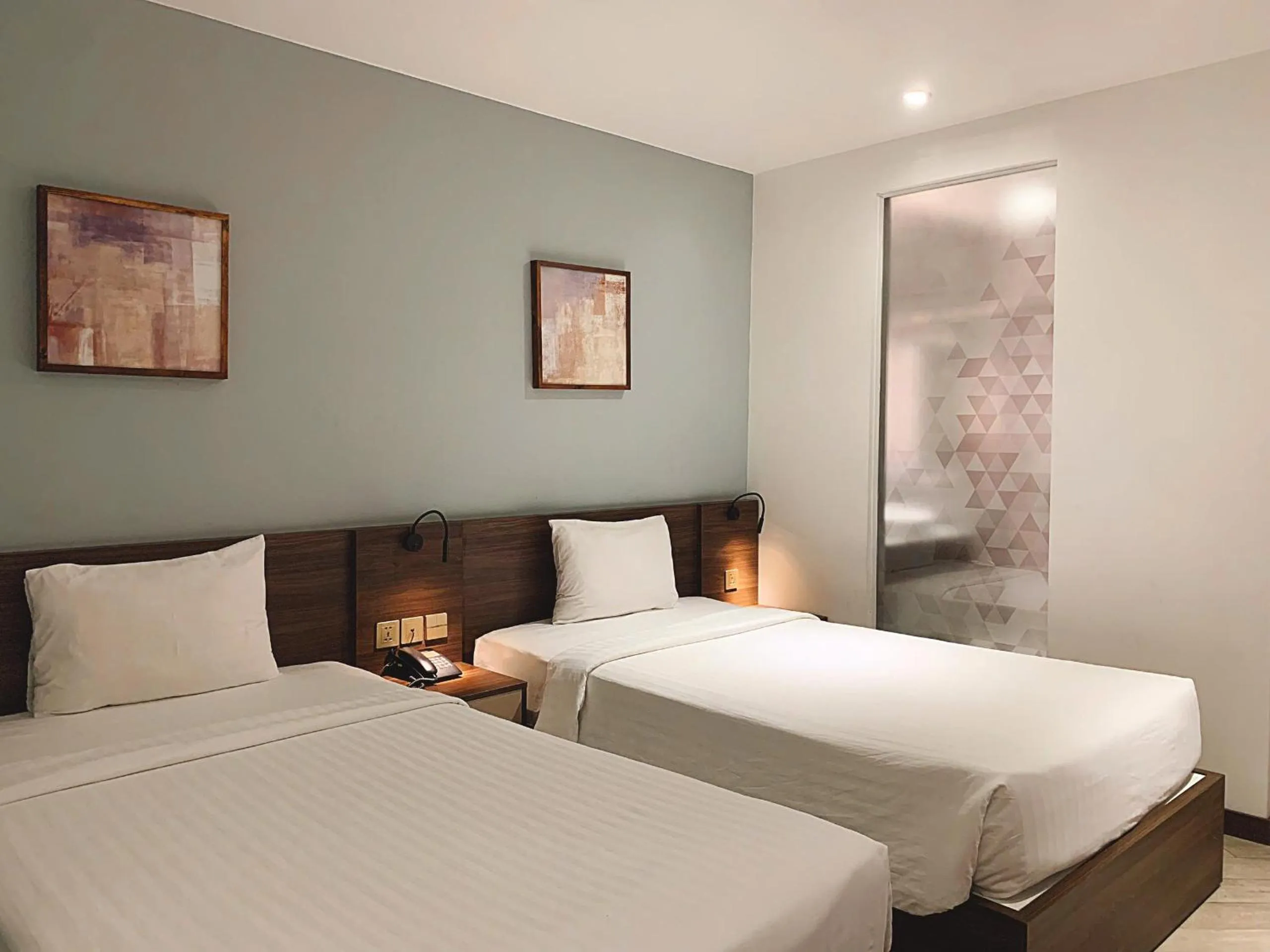 Bed in CHAU KHUONG HOTEL