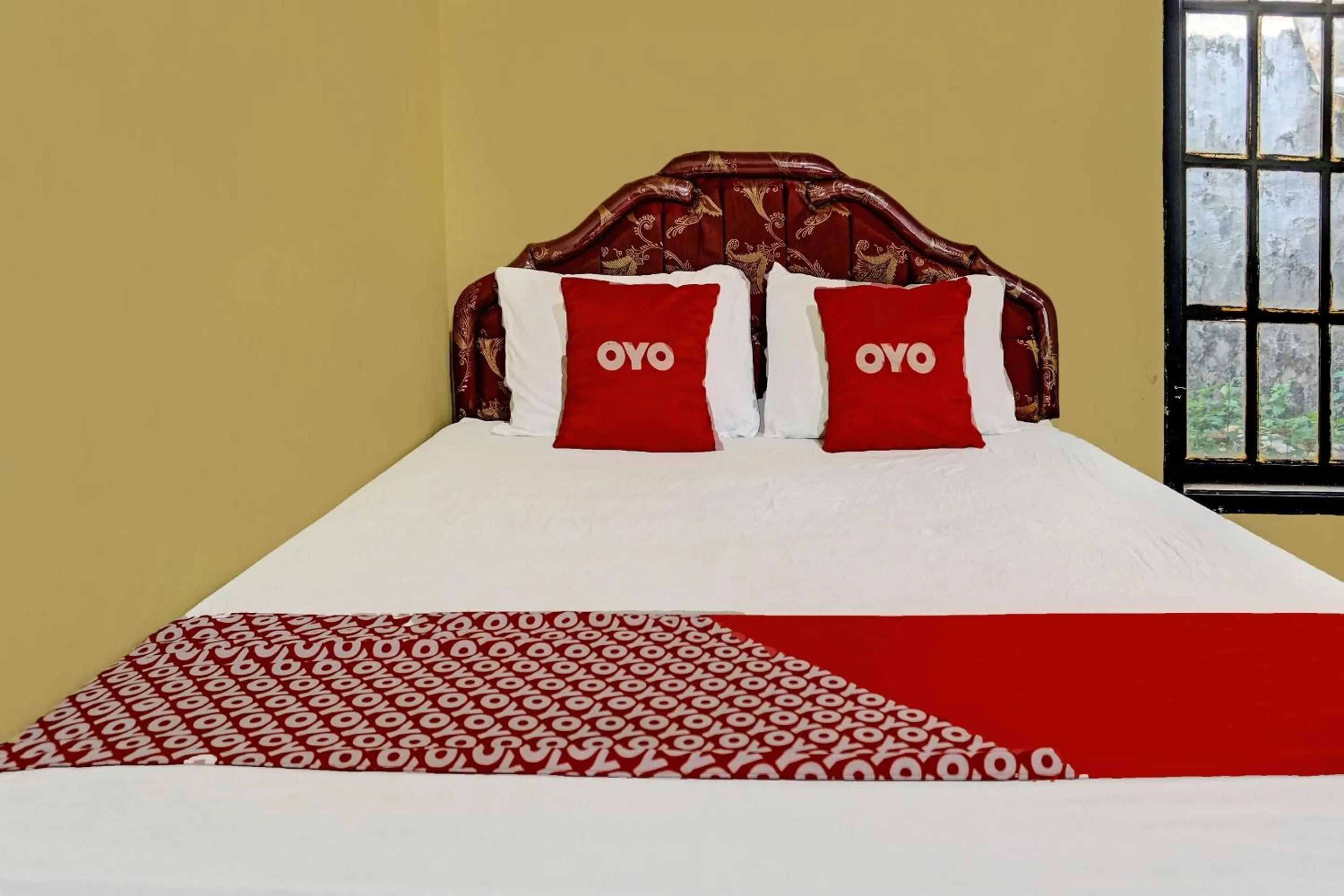 Bedroom in SPOT ON 91798 Hotel Grand Mutiara