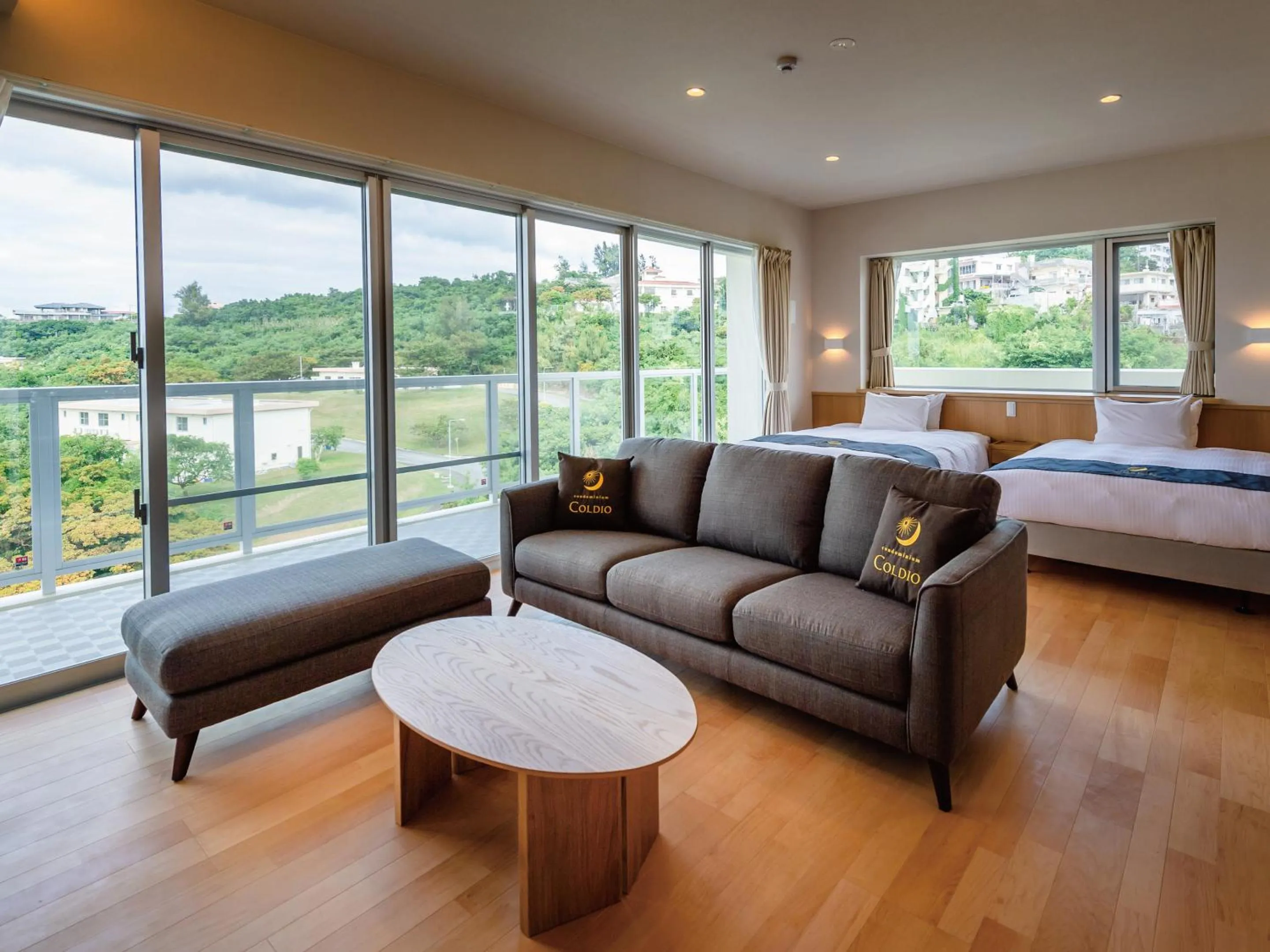 Living room, Bed in Private Condo Chatan Jagaru by Coldio Premium