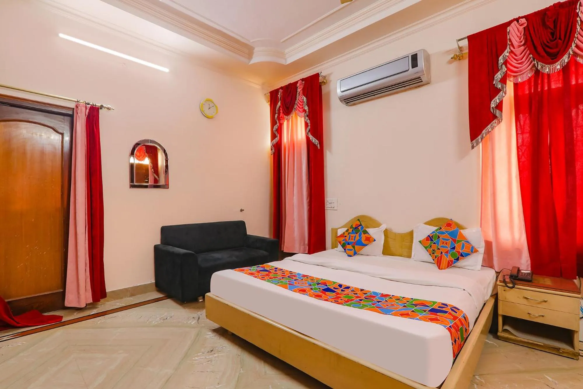 Bed in FabHotel Raka Inn