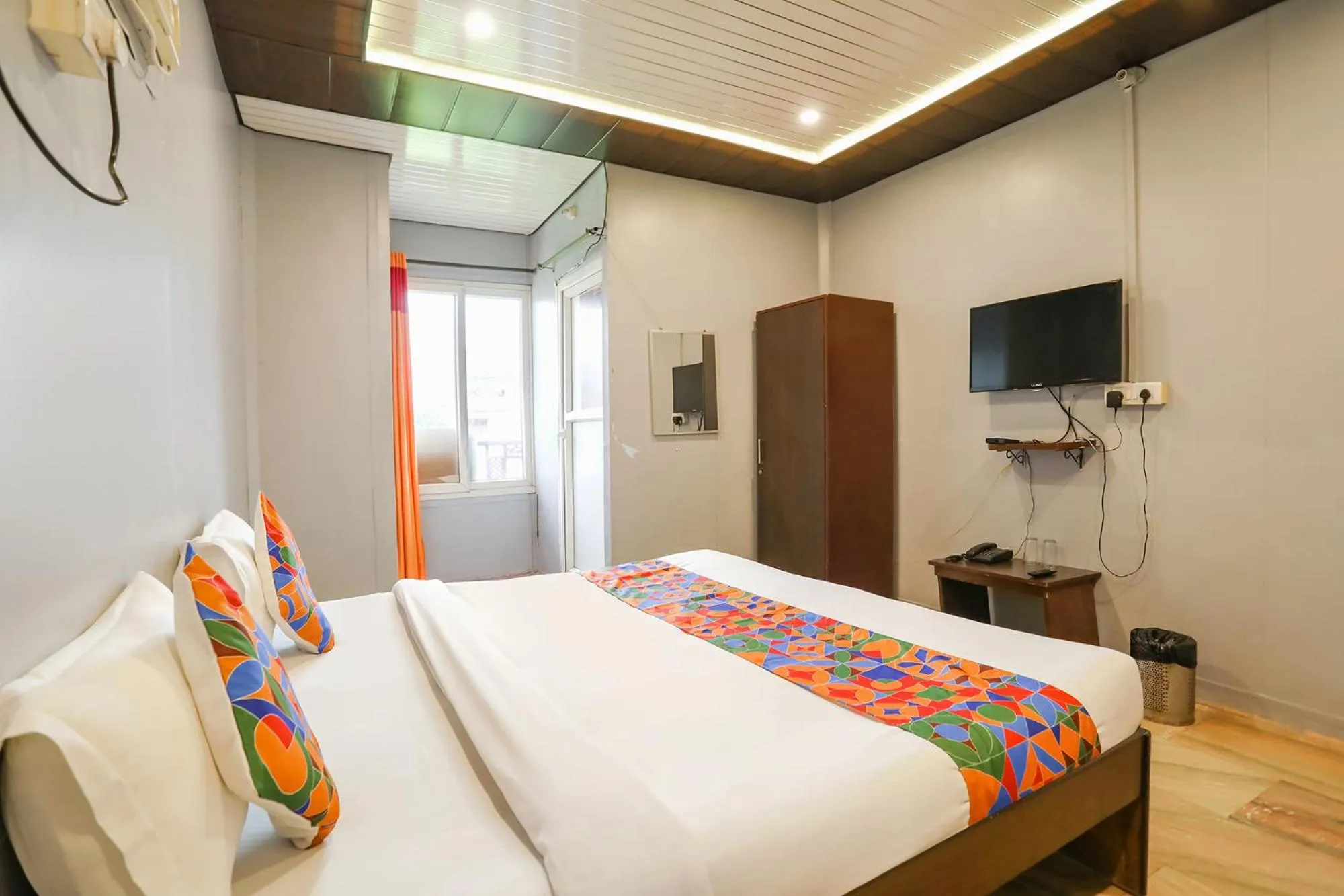 Bed in FabHotel Raka Inn