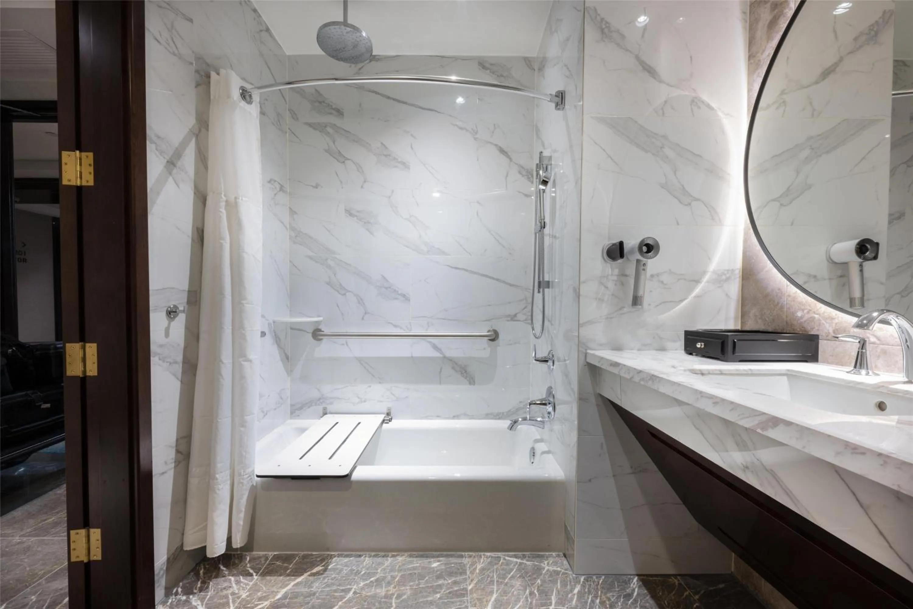 Bathroom in Blossom Hotel Houston, Curio Collection by Hilton