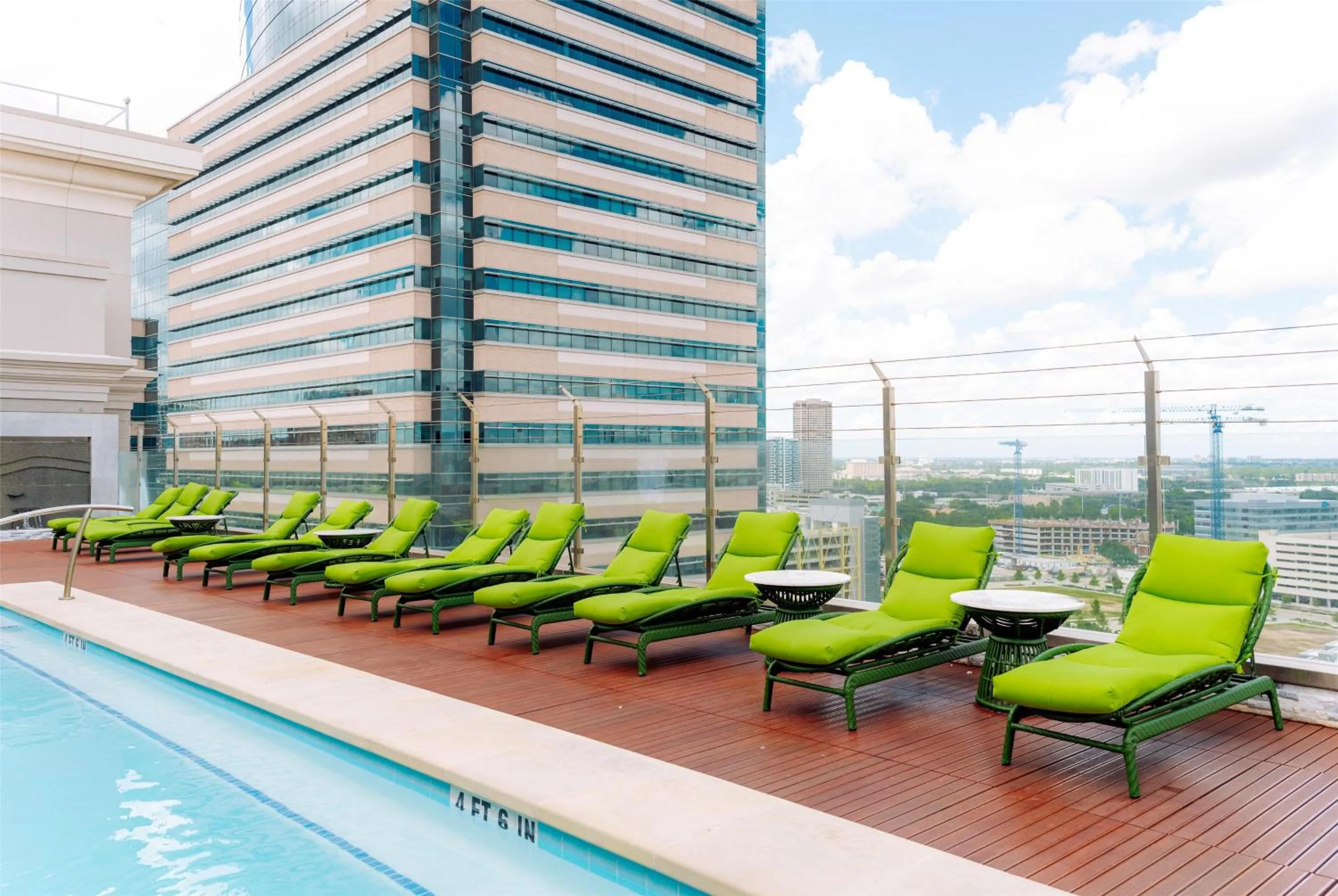 Pool view in Blossom Hotel Houston, Curio Collection by Hilton