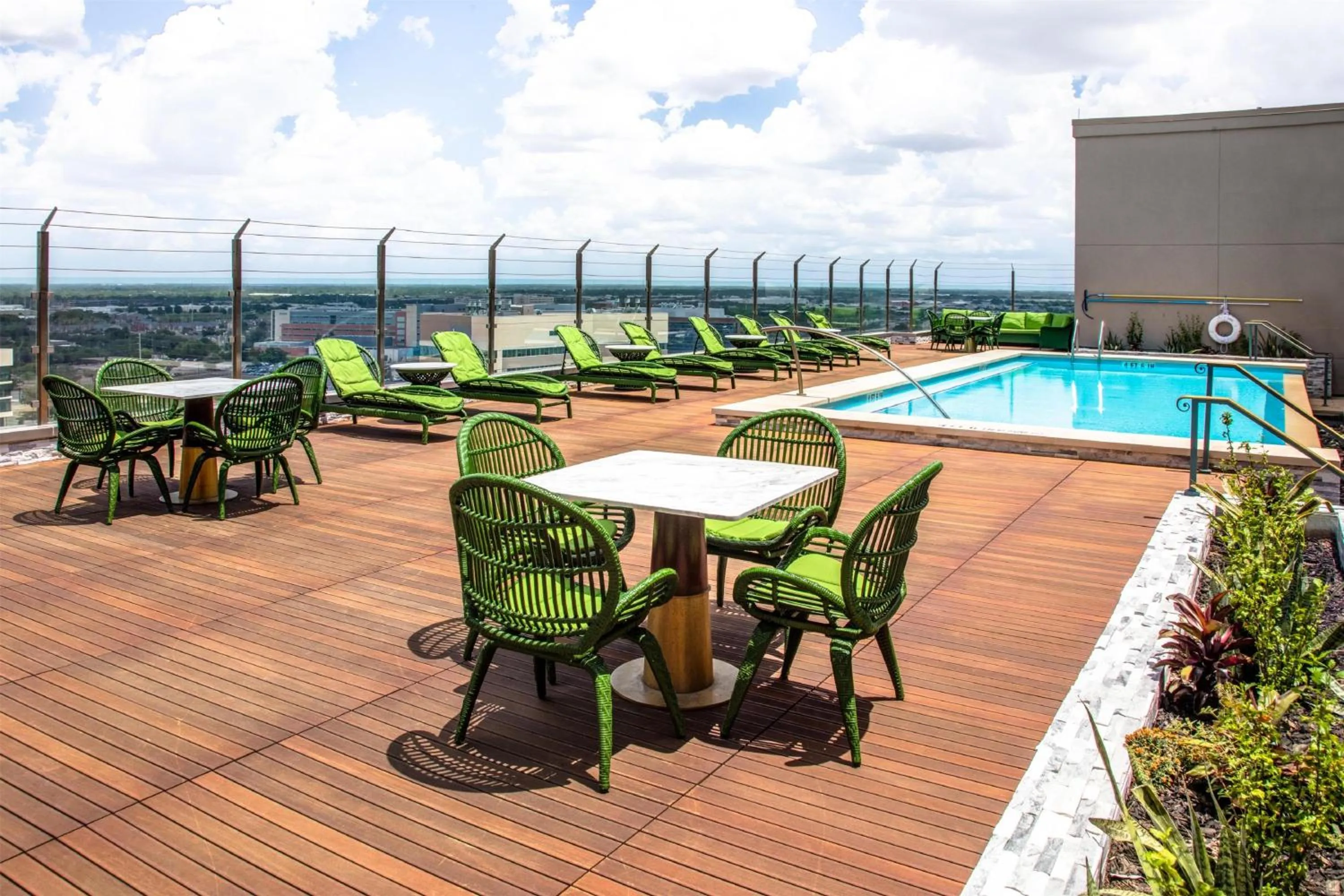 Pool view in Blossom Hotel Houston, Curio Collection by Hilton