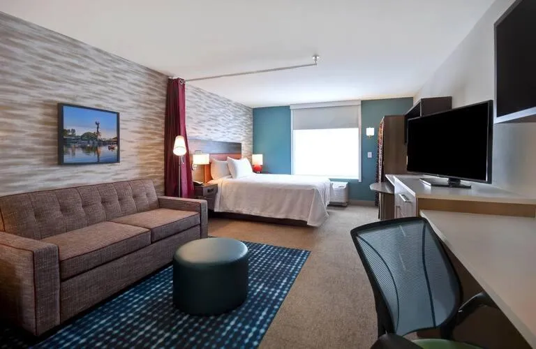 Seating area, Bed in Home2 Suites Wichita Downtown Delano, Ks