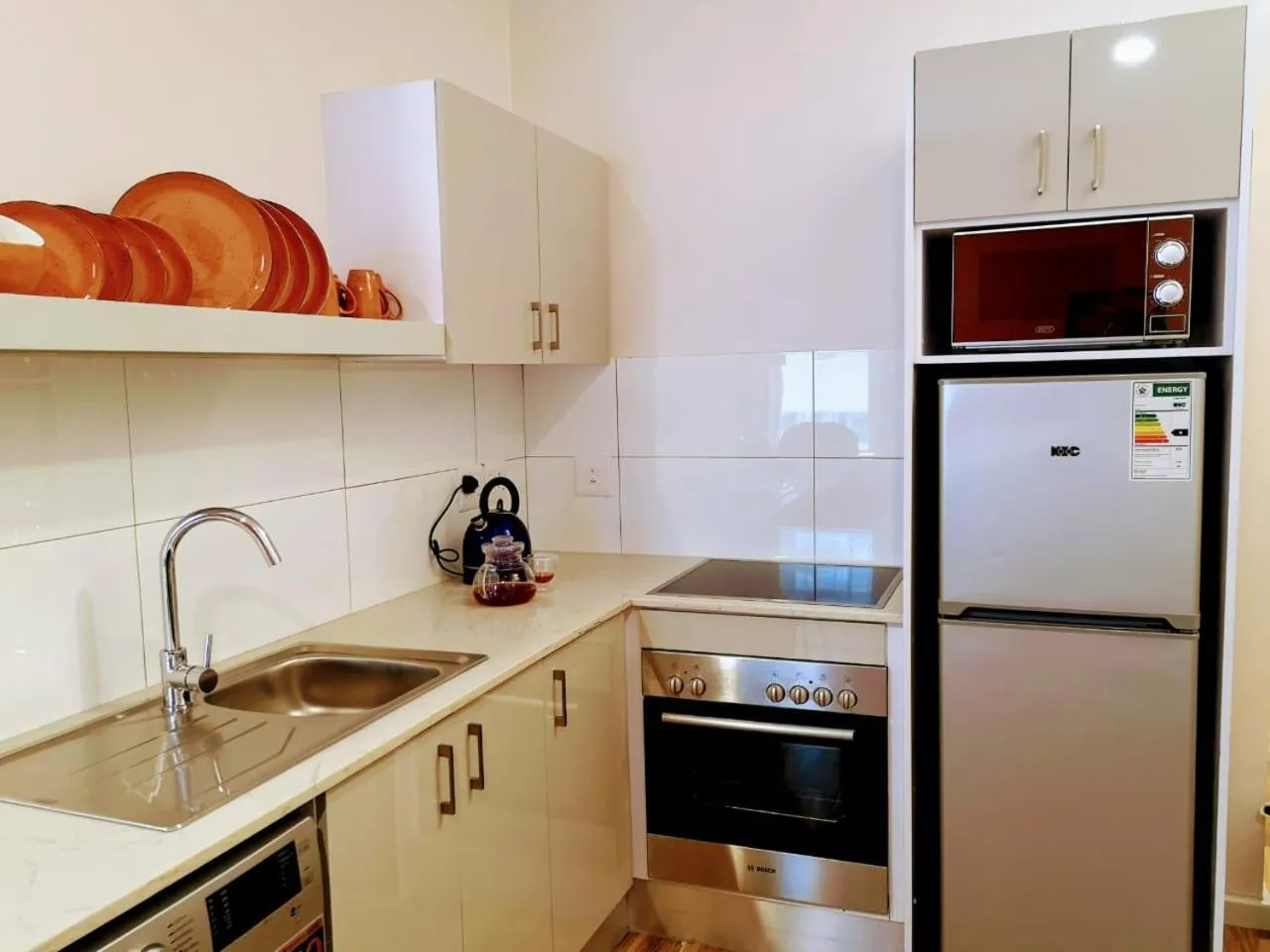 Kitchen or kitchenette in Urban Oasis Aparthotel