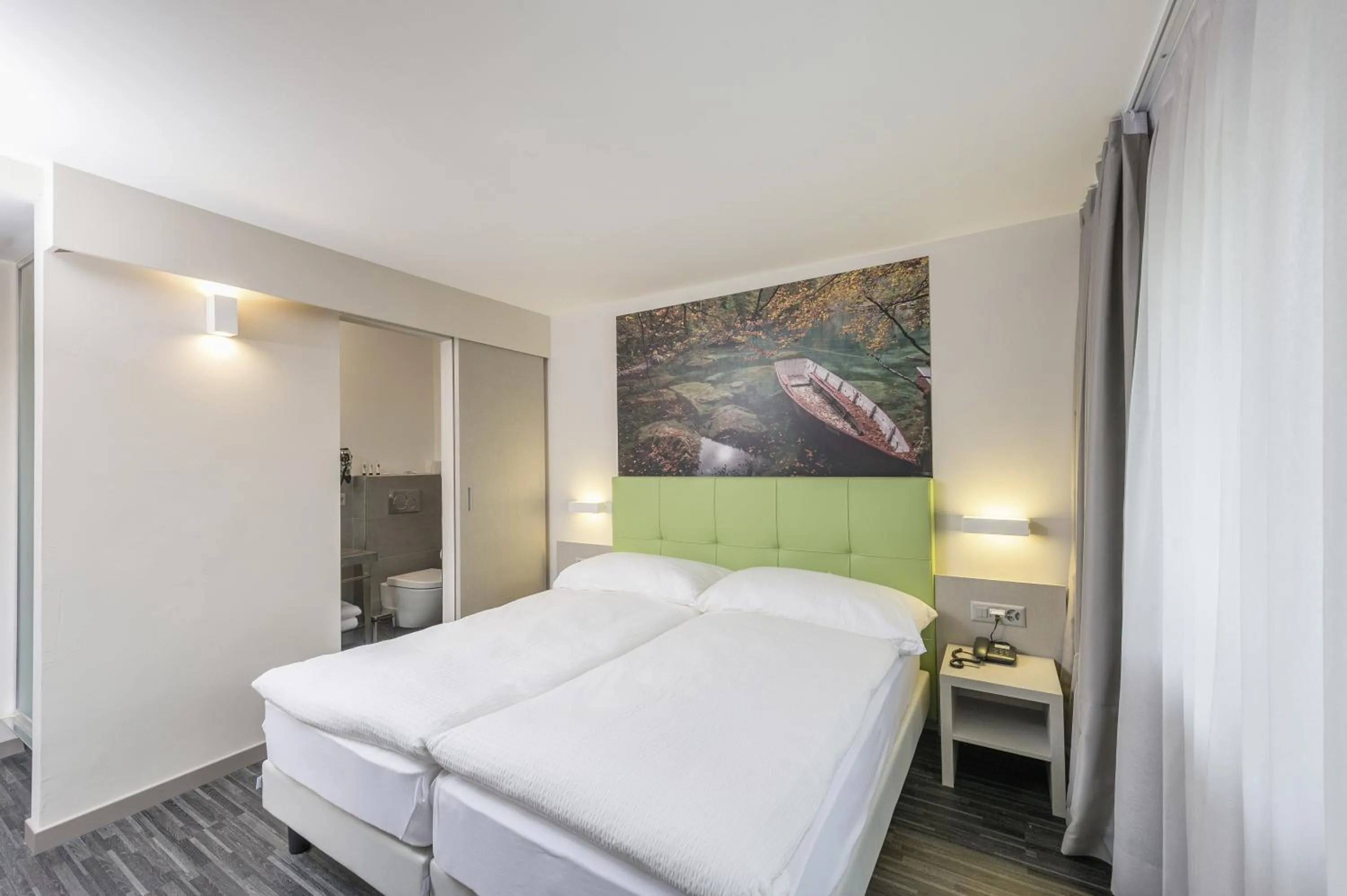 Photo of the whole room, Bed in Adhhoc Hotel