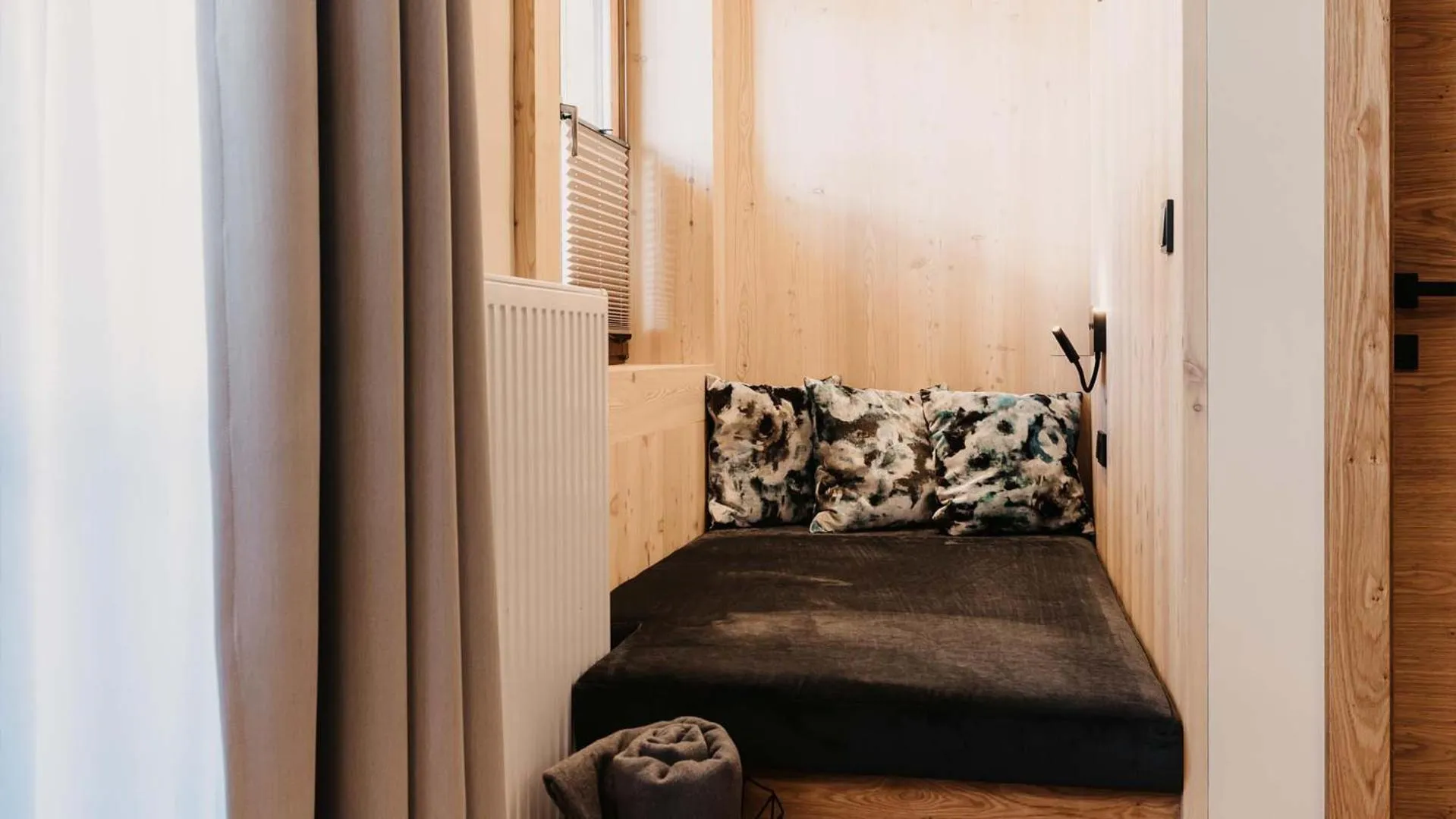 Seating area, Bed in Hofgut Apartment & Lifestyle Resort Wagrain