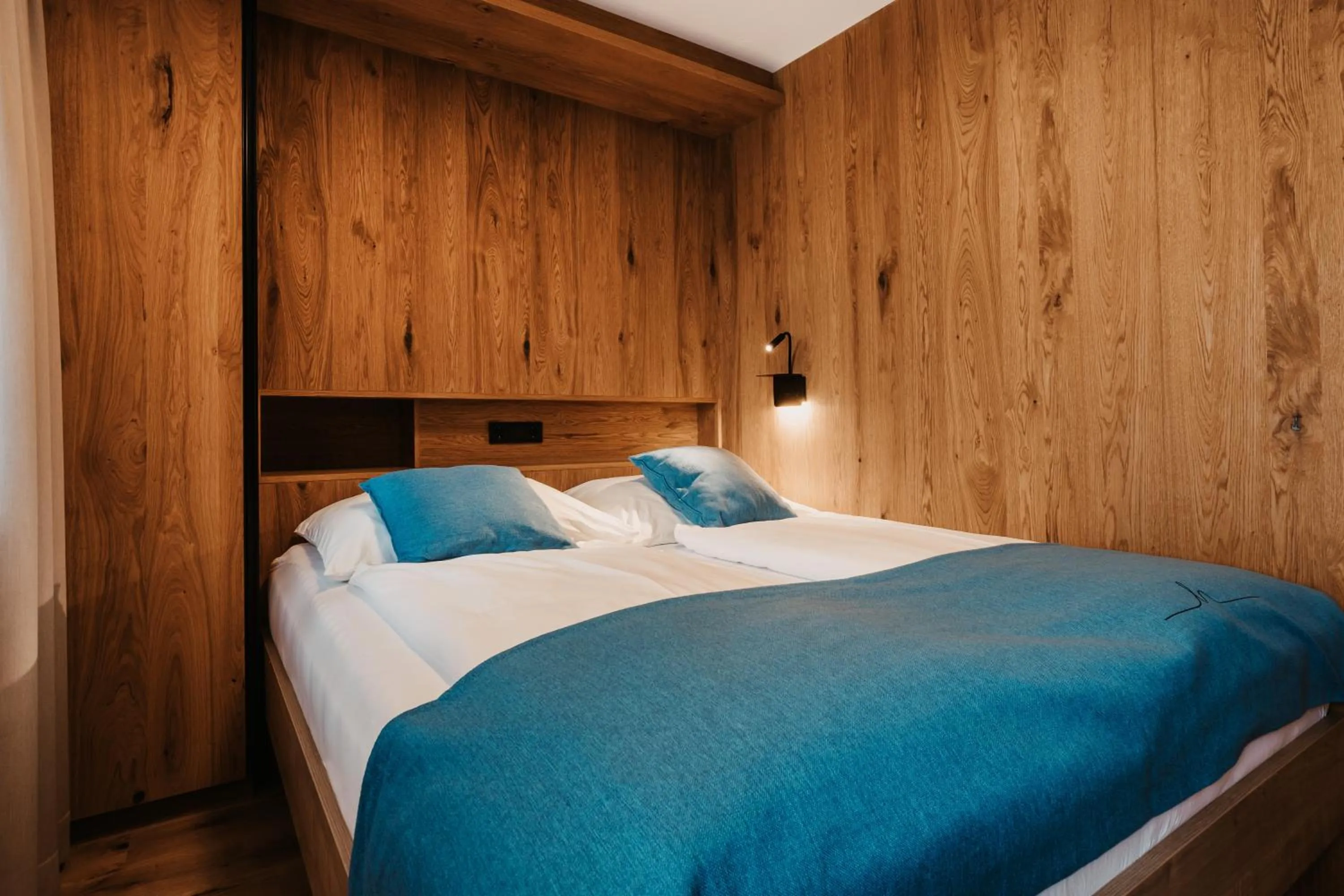 Bed in Hofgut Apartment & Lifestyle Resort Wagrain