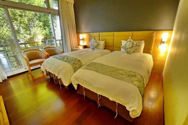 Bed in Jun Yue Hanging Garden Resort