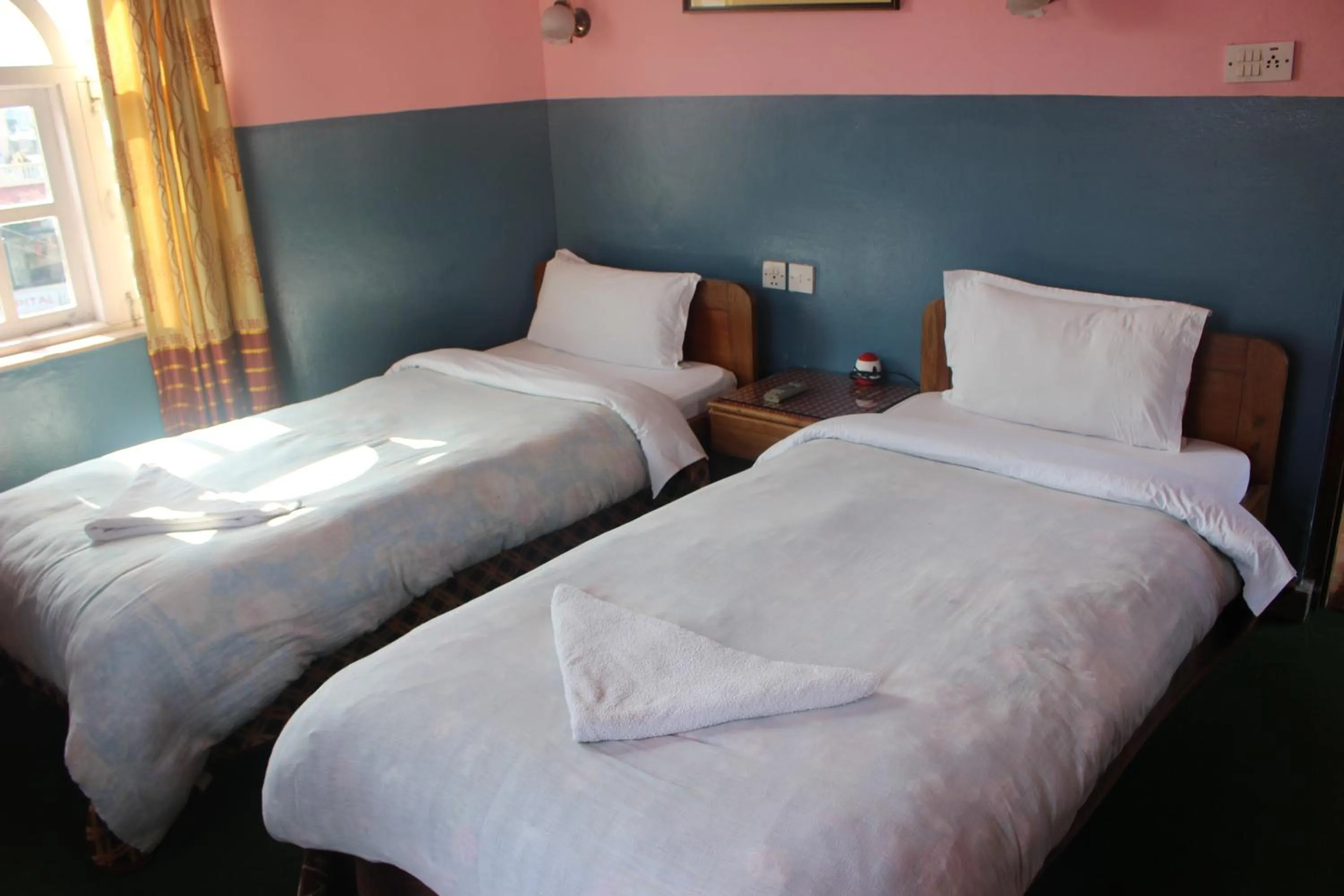 Bed in Hotel Fishtail Villa