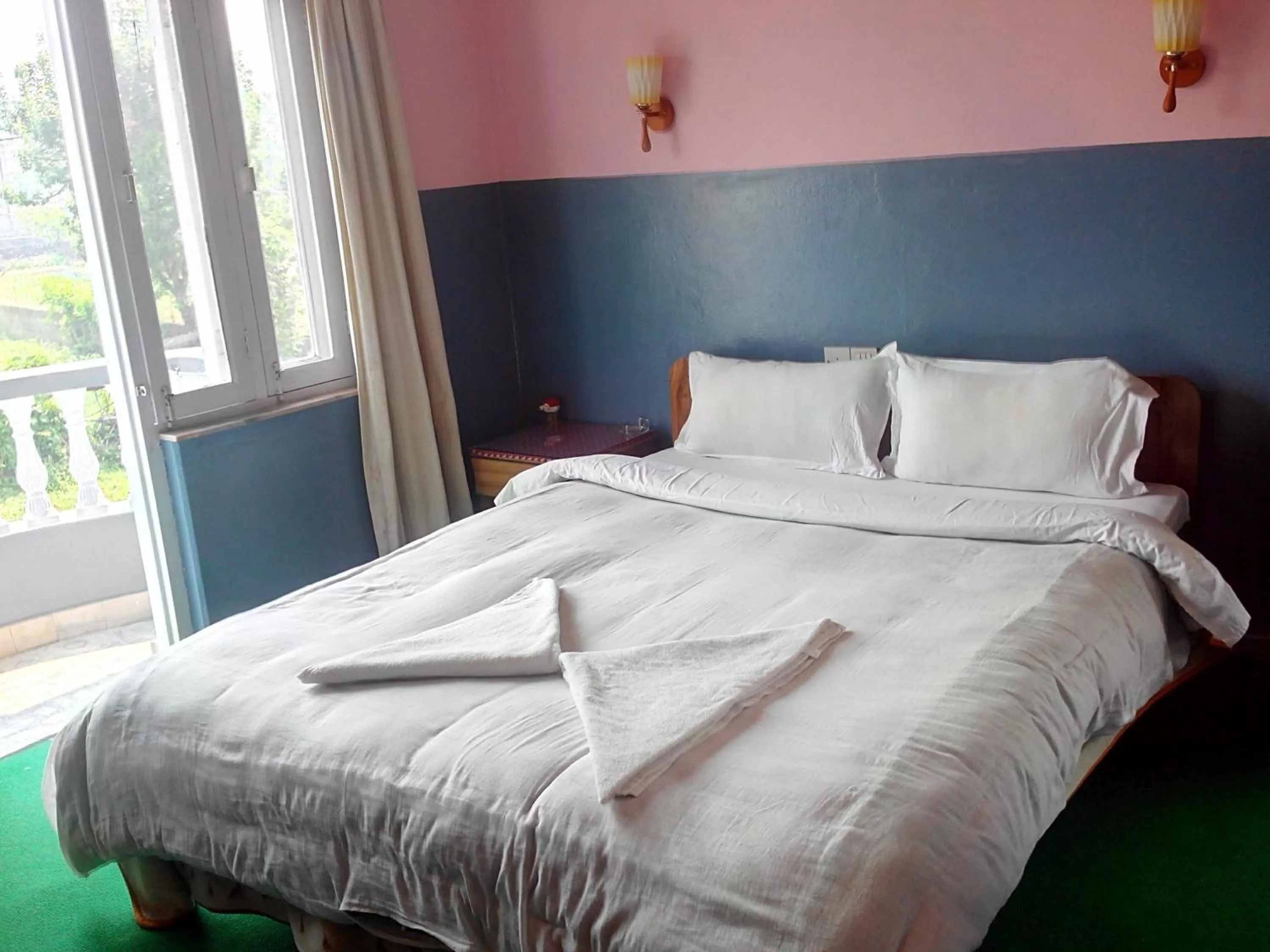 Bed in Hotel Fishtail Villa