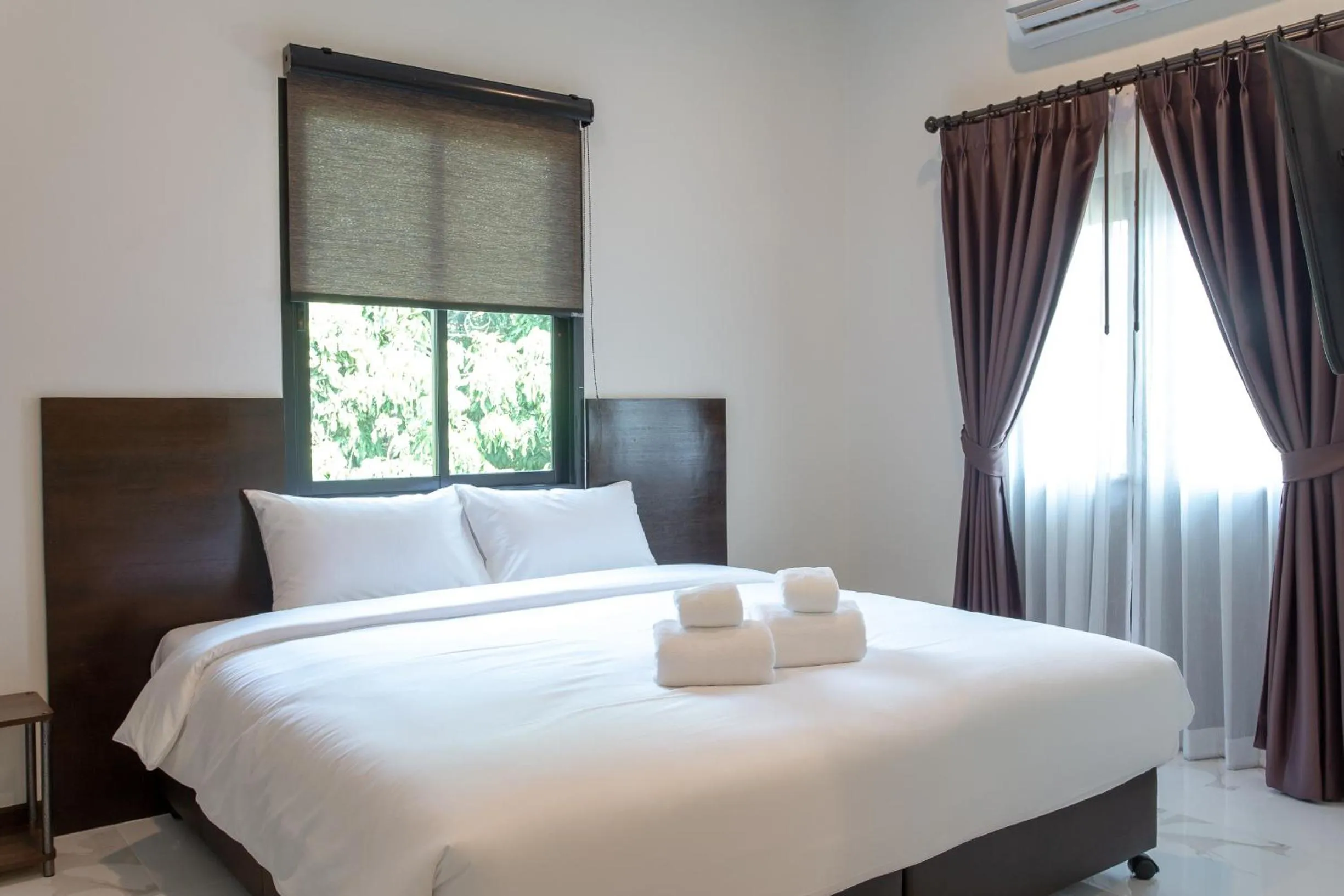 Bed in Khampare Chiang Mai Hotel