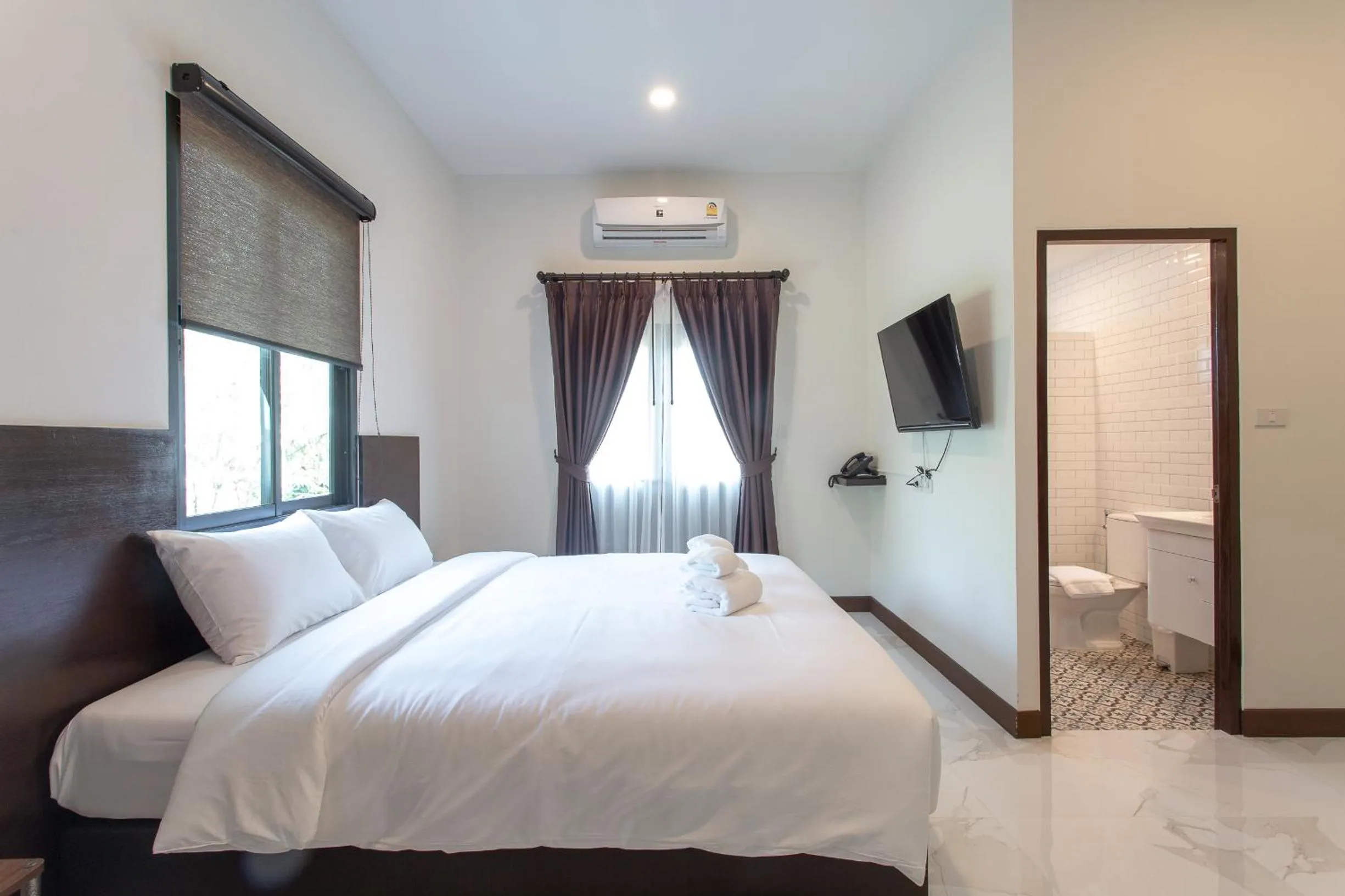 Bed in Khampare Chiang Mai Hotel