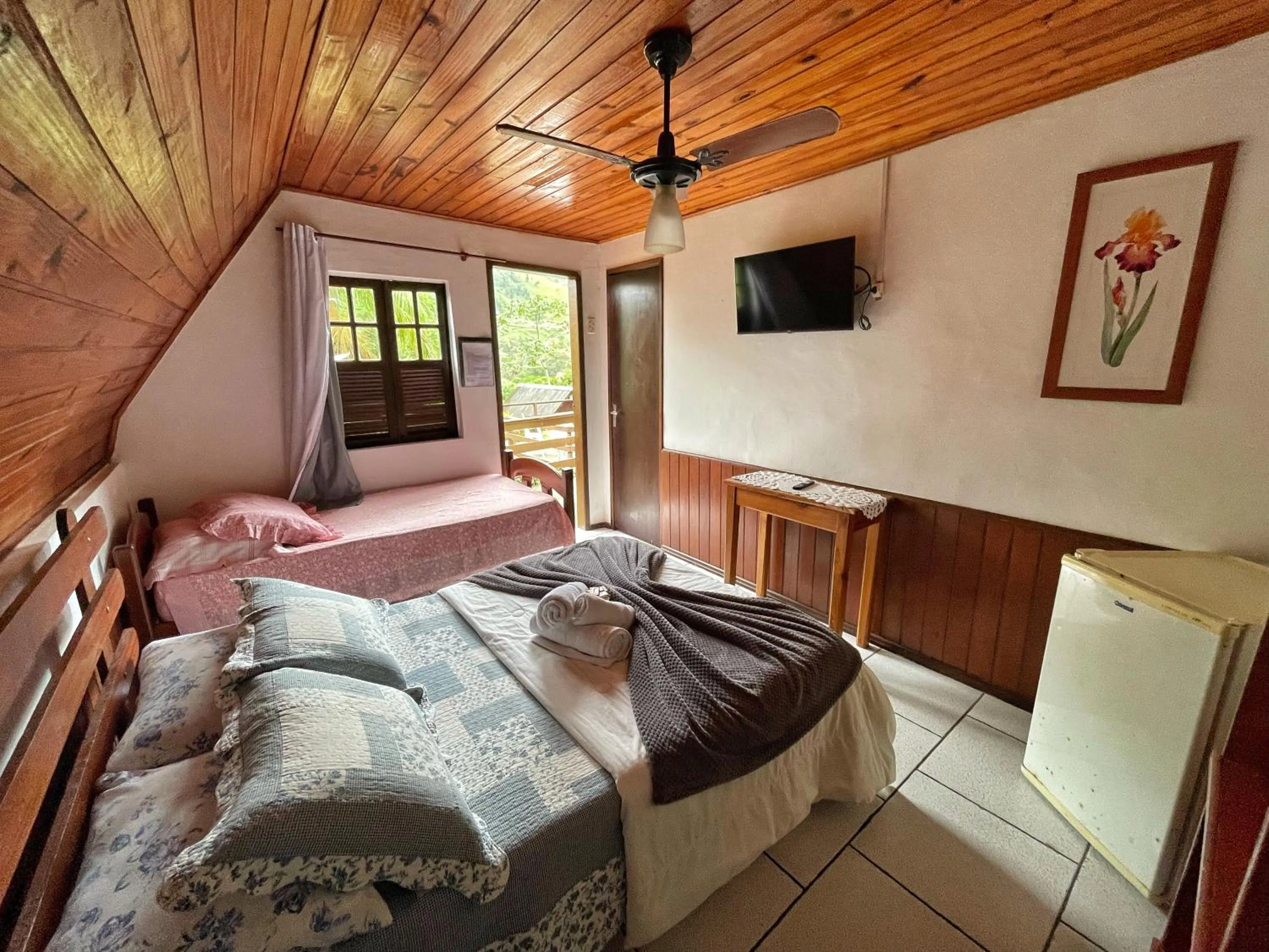 Bed in Pousada Colibri Serrano