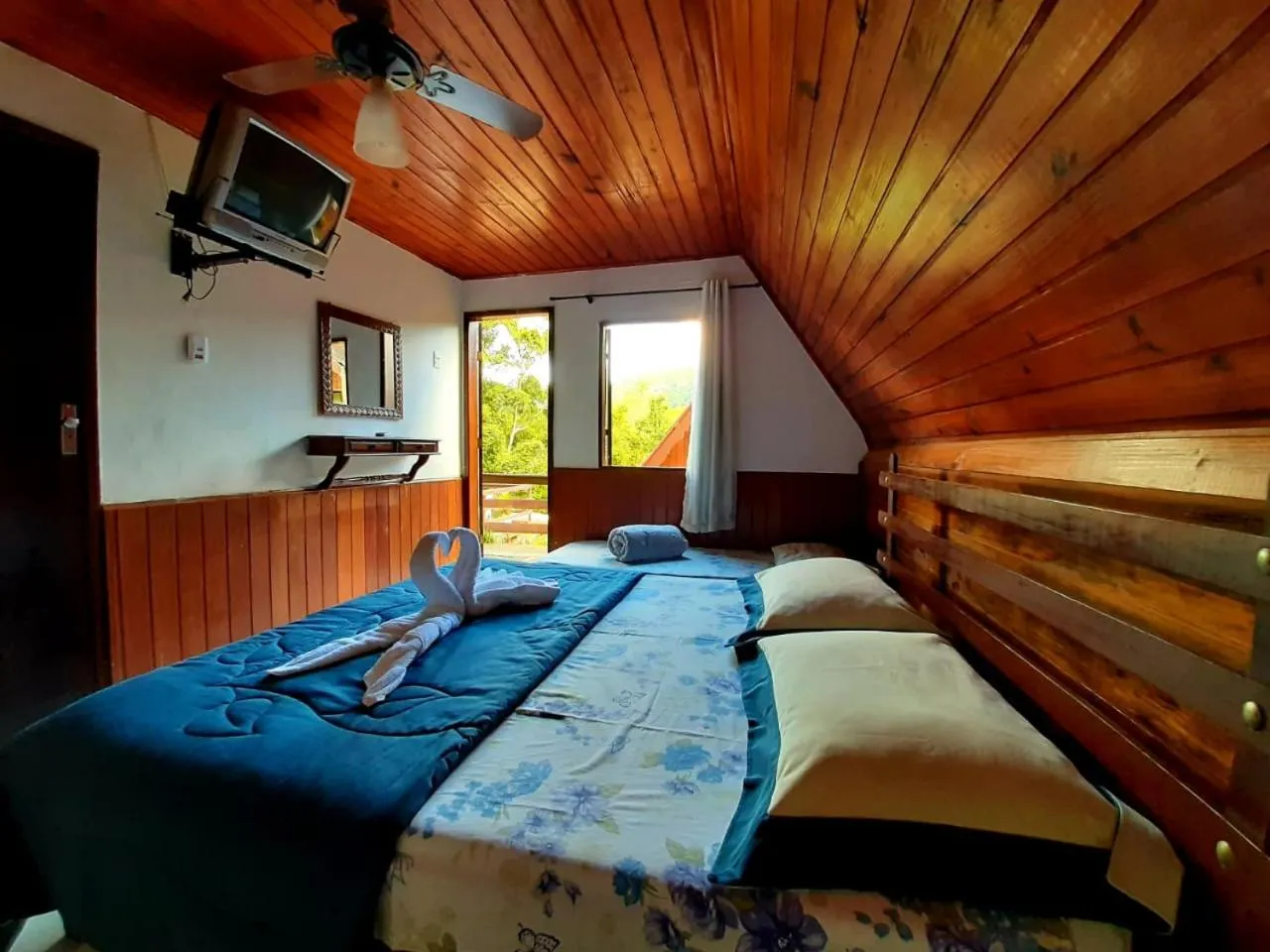 Bed in Pousada Colibri Serrano