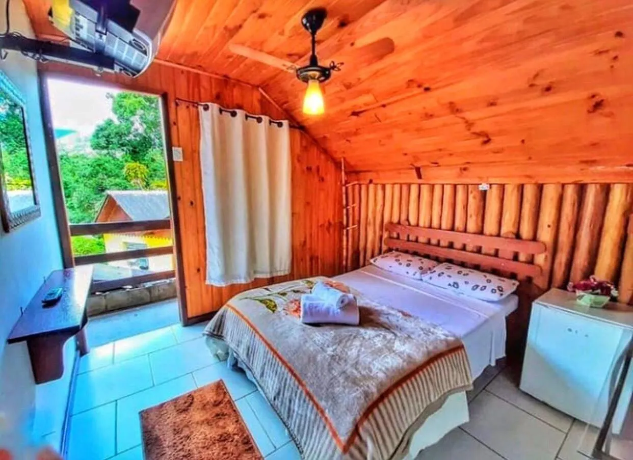 Bed in Pousada Colibri Serrano