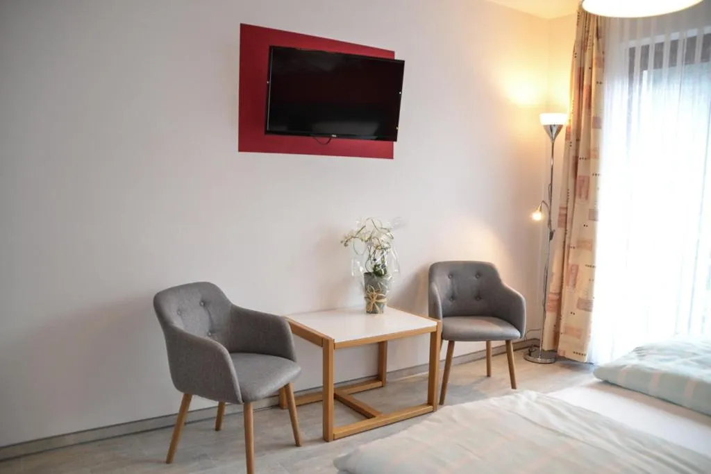 Seating area, Bed in Landhotel Kunzental