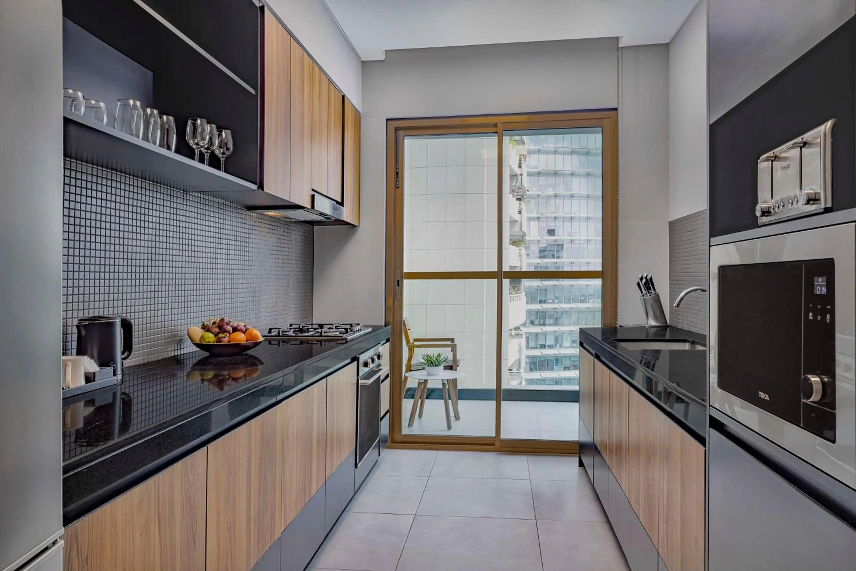 Kitchen or kitchenette in DoubleTree by Hilton Dubai M Square Hotel & Residences