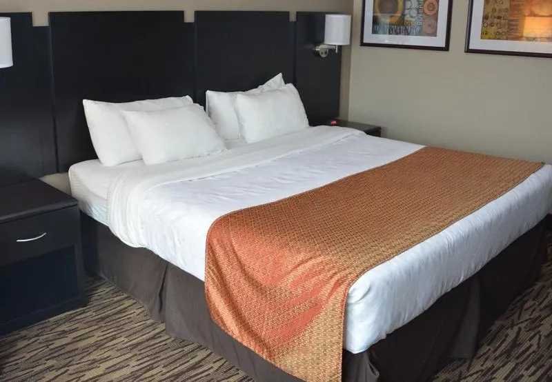 Bed in Roosevelt Inn & Suites