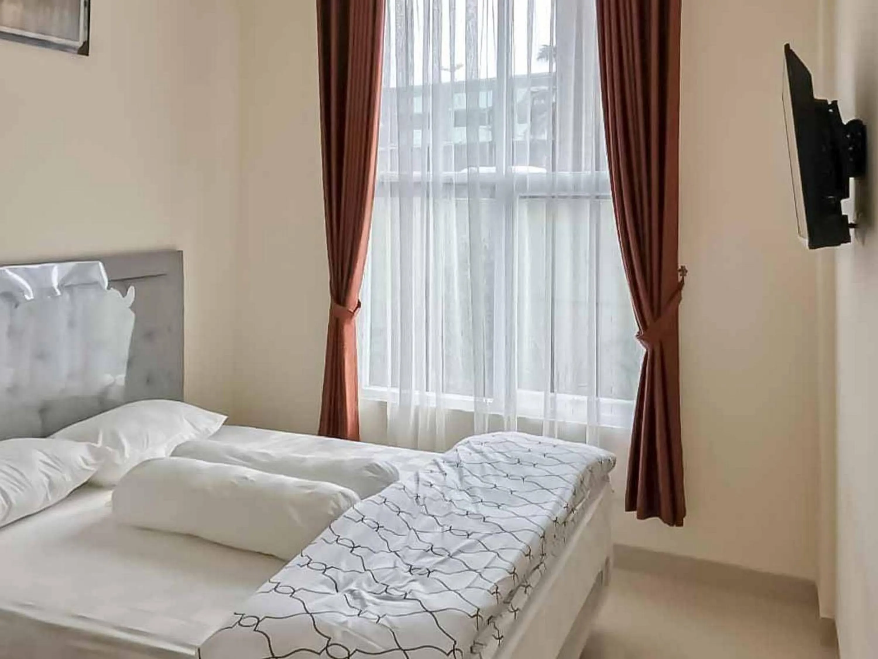 Bed in Wisma Talenta Mitra RedDoorz