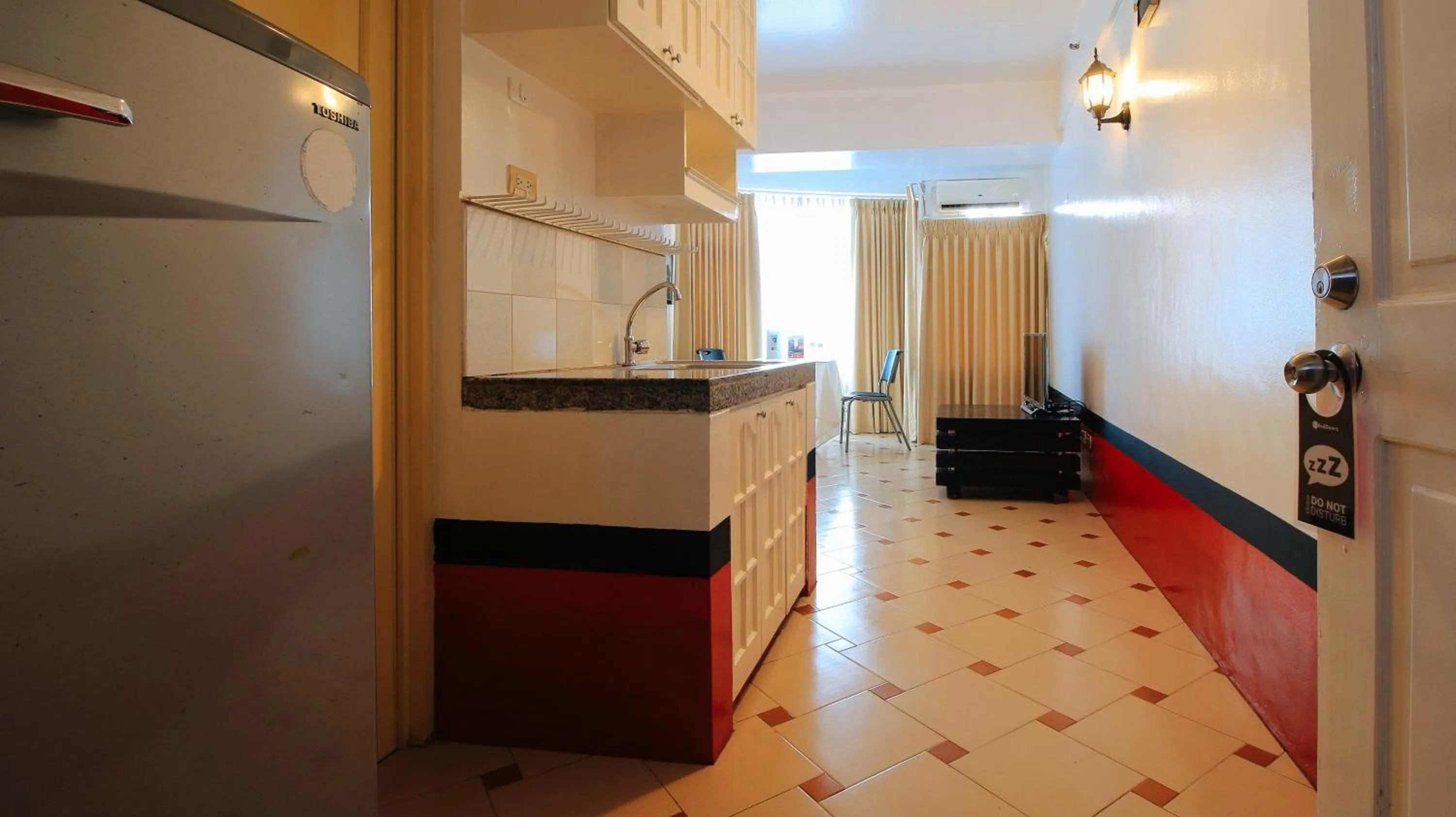 Kitchen or kitchenette in RedDoorz at The Providence Tower