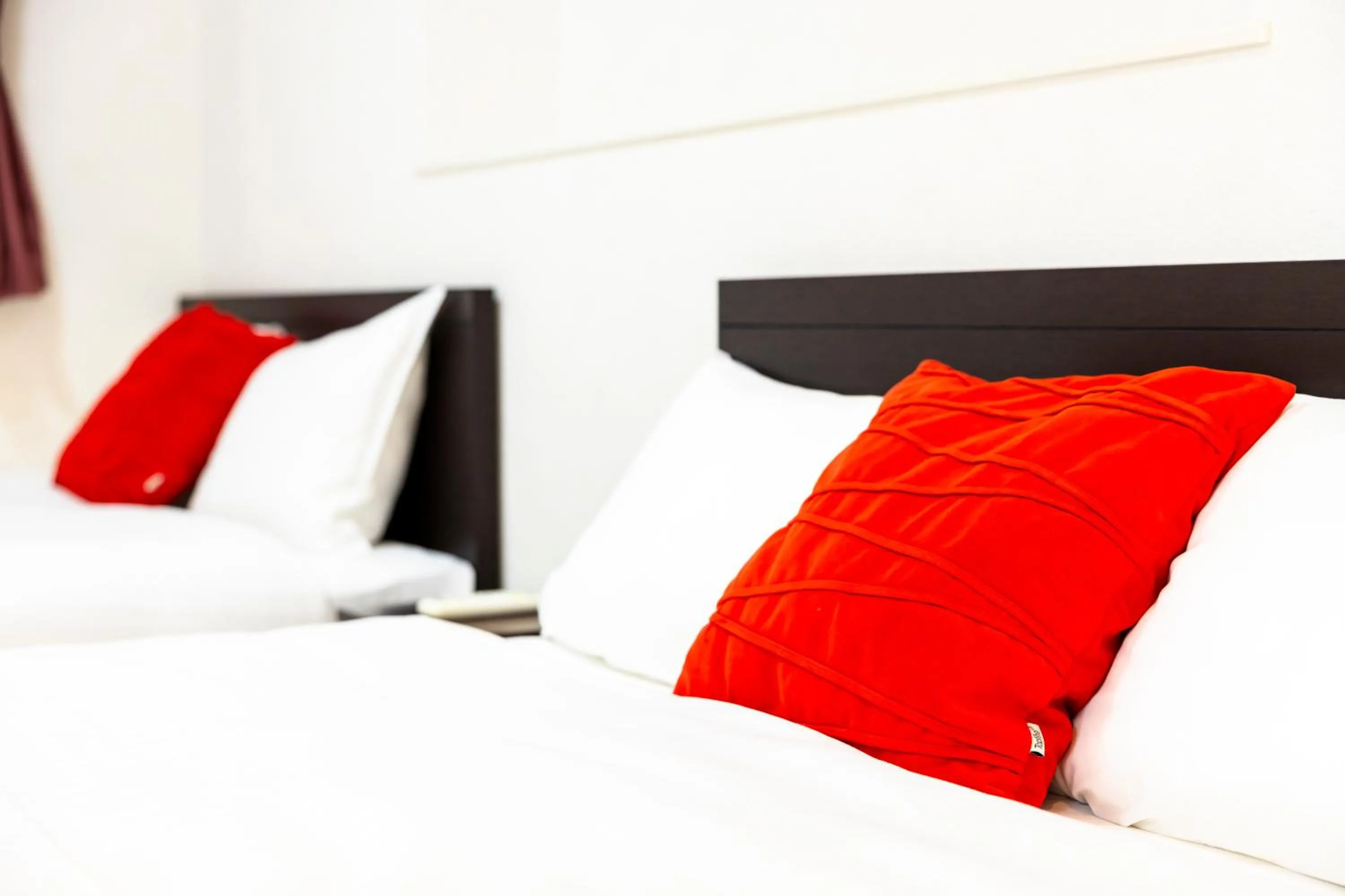 Bed in Riverside Inn Hakata