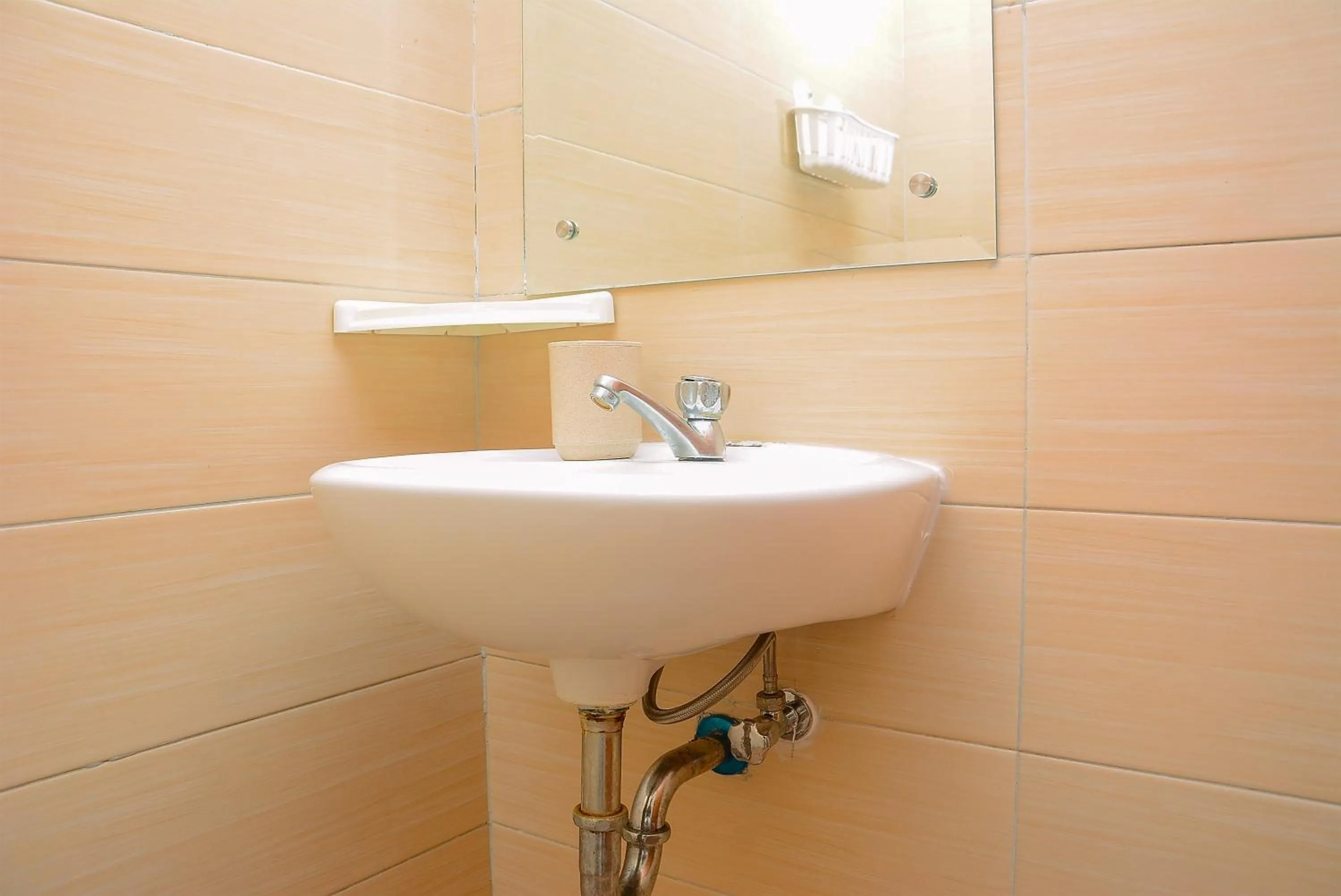 Bathroom in Elegant Studio Apartment Margonda Residence 5 By Travelio