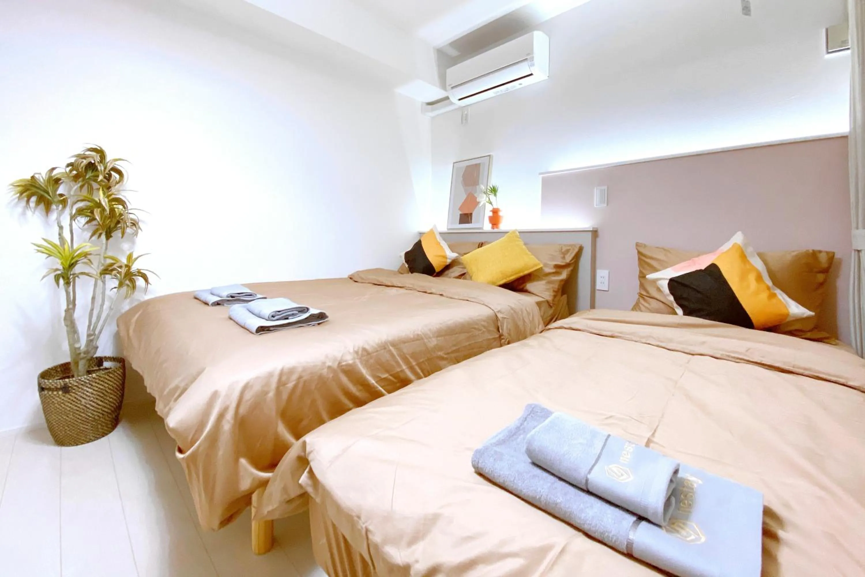 Bed in nestay apartment tokyo ginza
