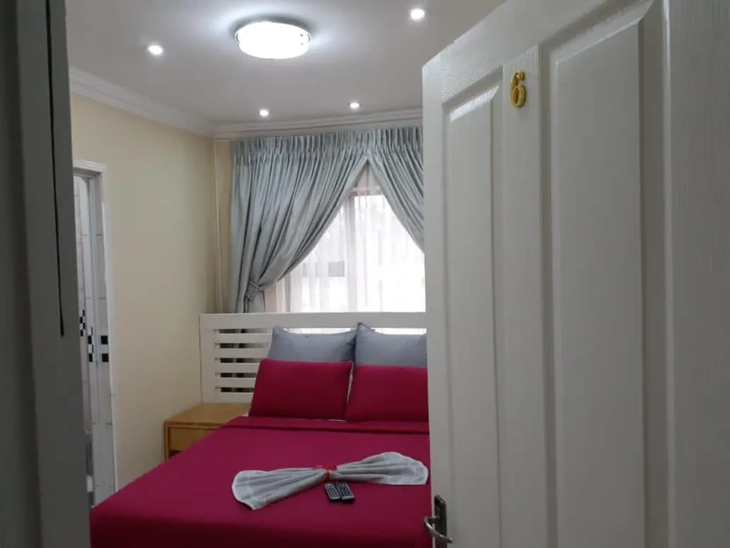 Bed in Ekaya Palace Guest House