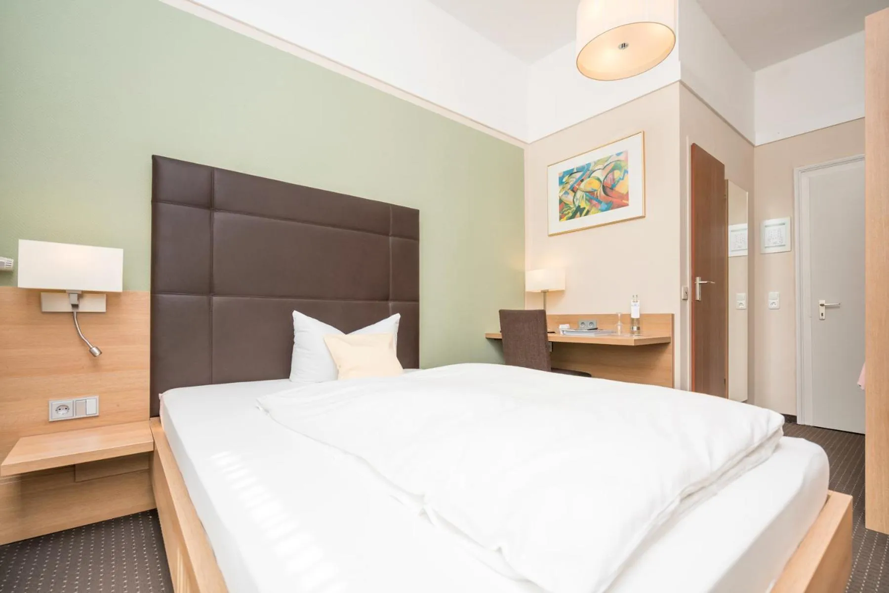 Photo of the whole room, Bed in Seehotel Grauer Bär