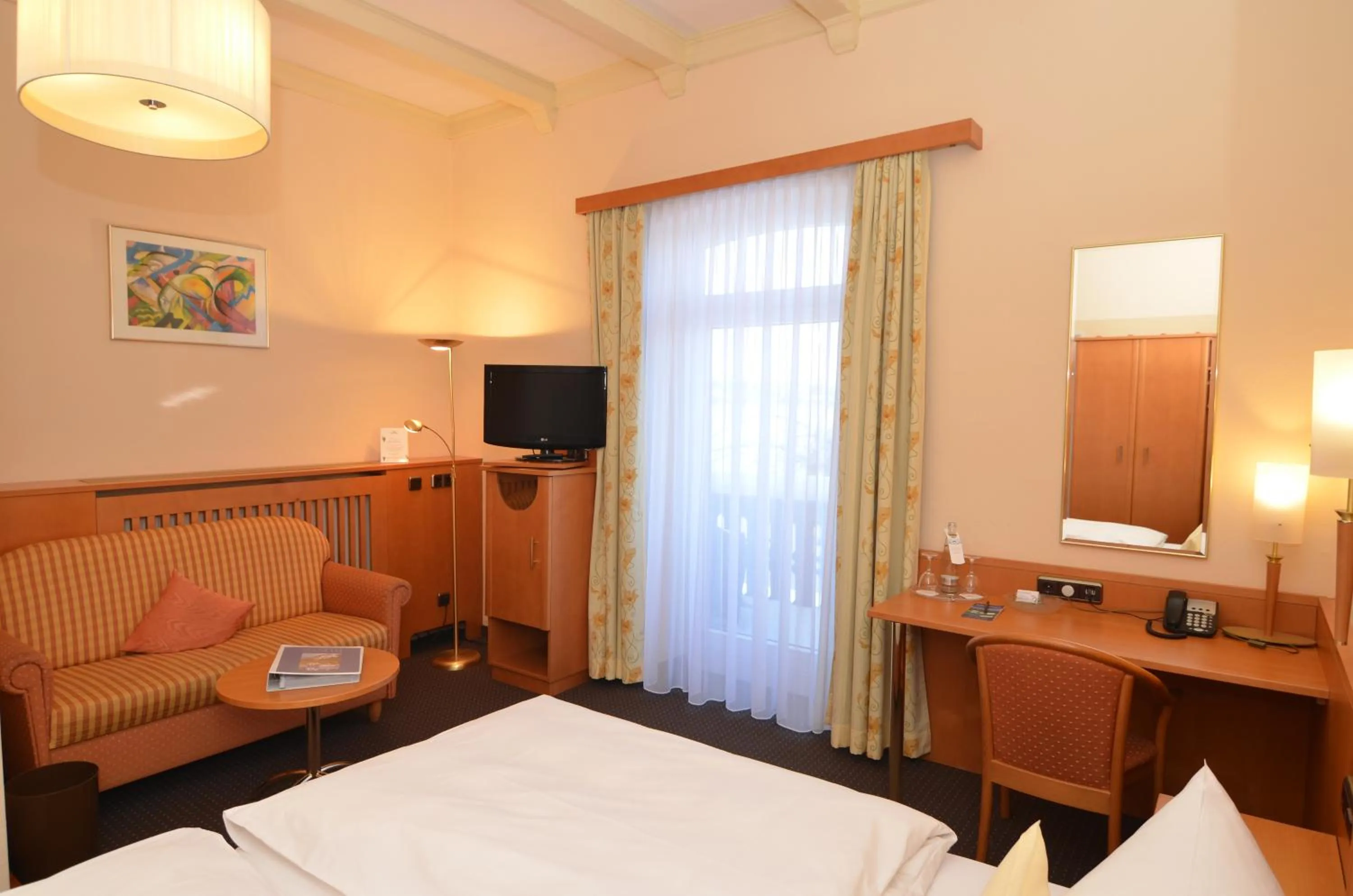 Photo of the whole room, Bed in Seehotel Grauer Bär