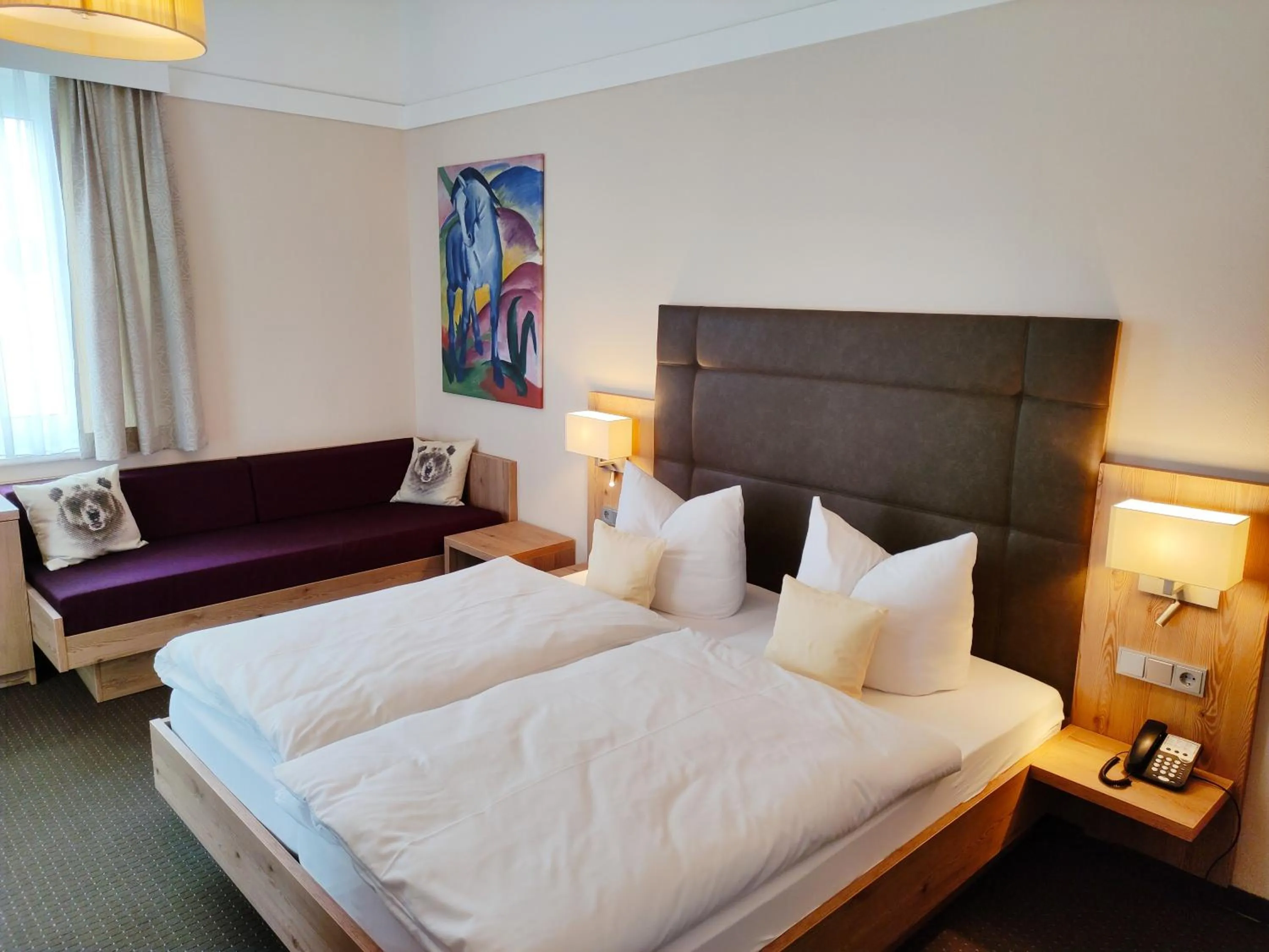 Photo of the whole room, Bed in Seehotel Grauer Bär