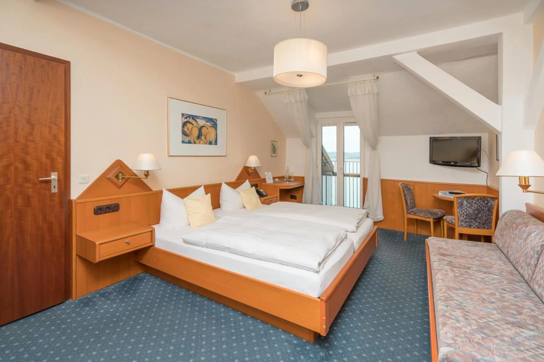 Photo of the whole room, Bed in Seehotel Grauer Bär