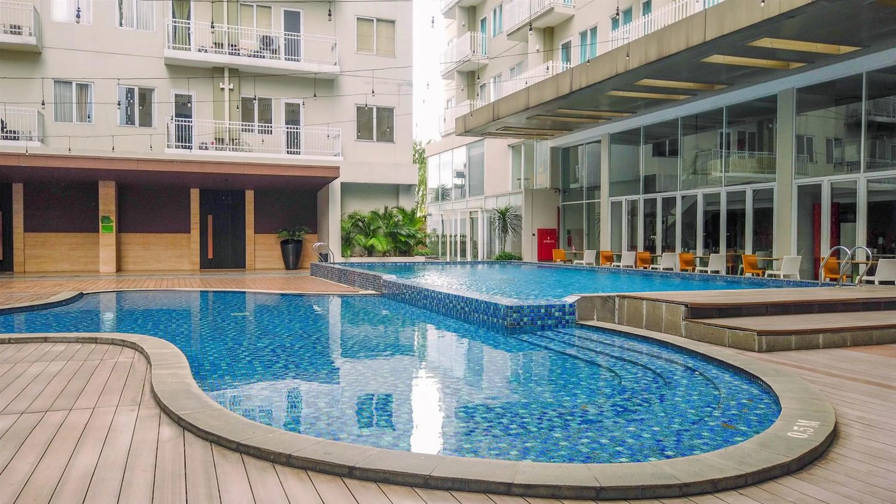 Property building in Minimalist Studio at 11st Floor Bogor Icon Apartment By Travelio