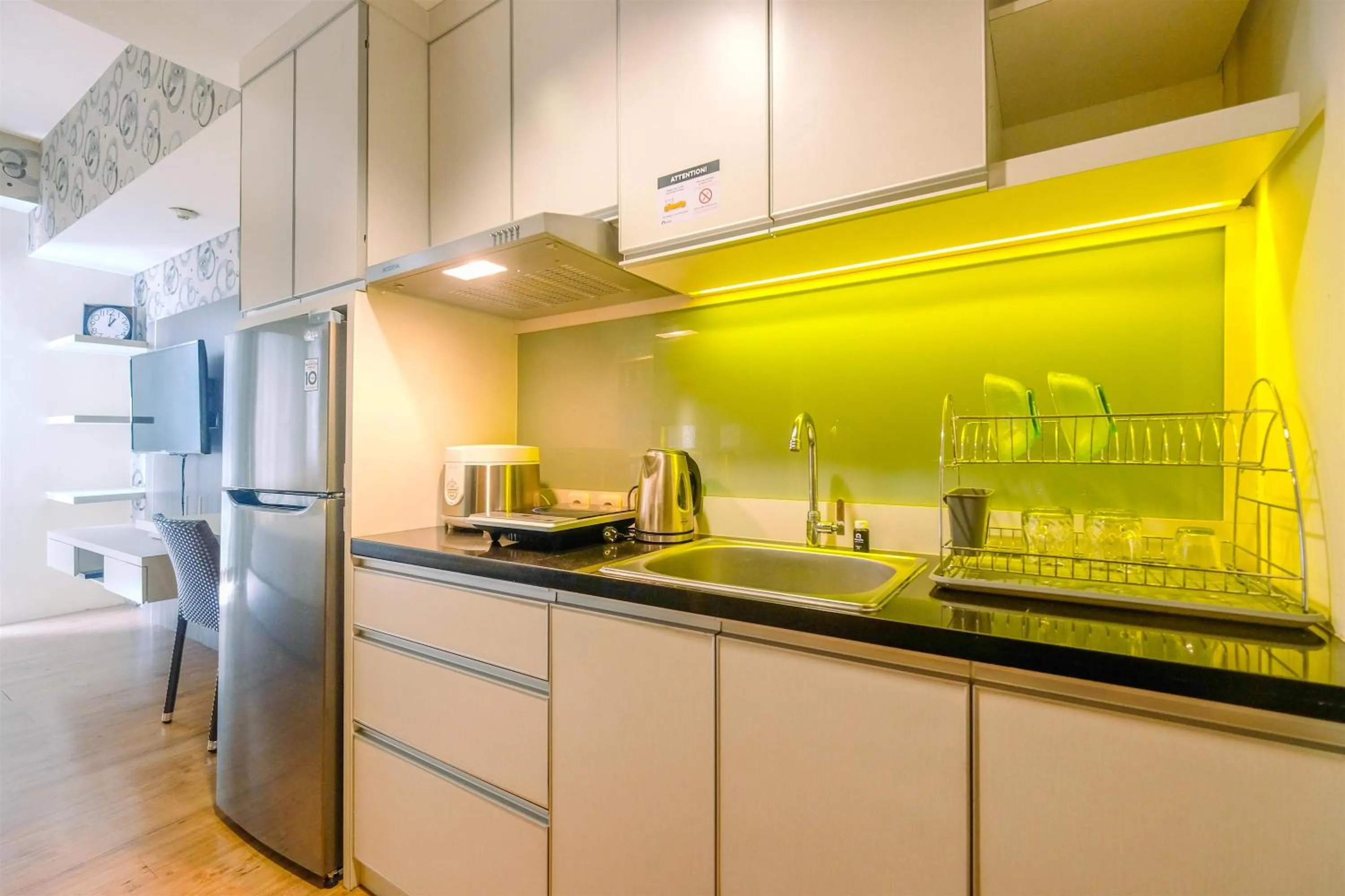Kitchen or kitchenette in Minimalist Studio at 11st Floor Bogor Icon Apartment By Travelio