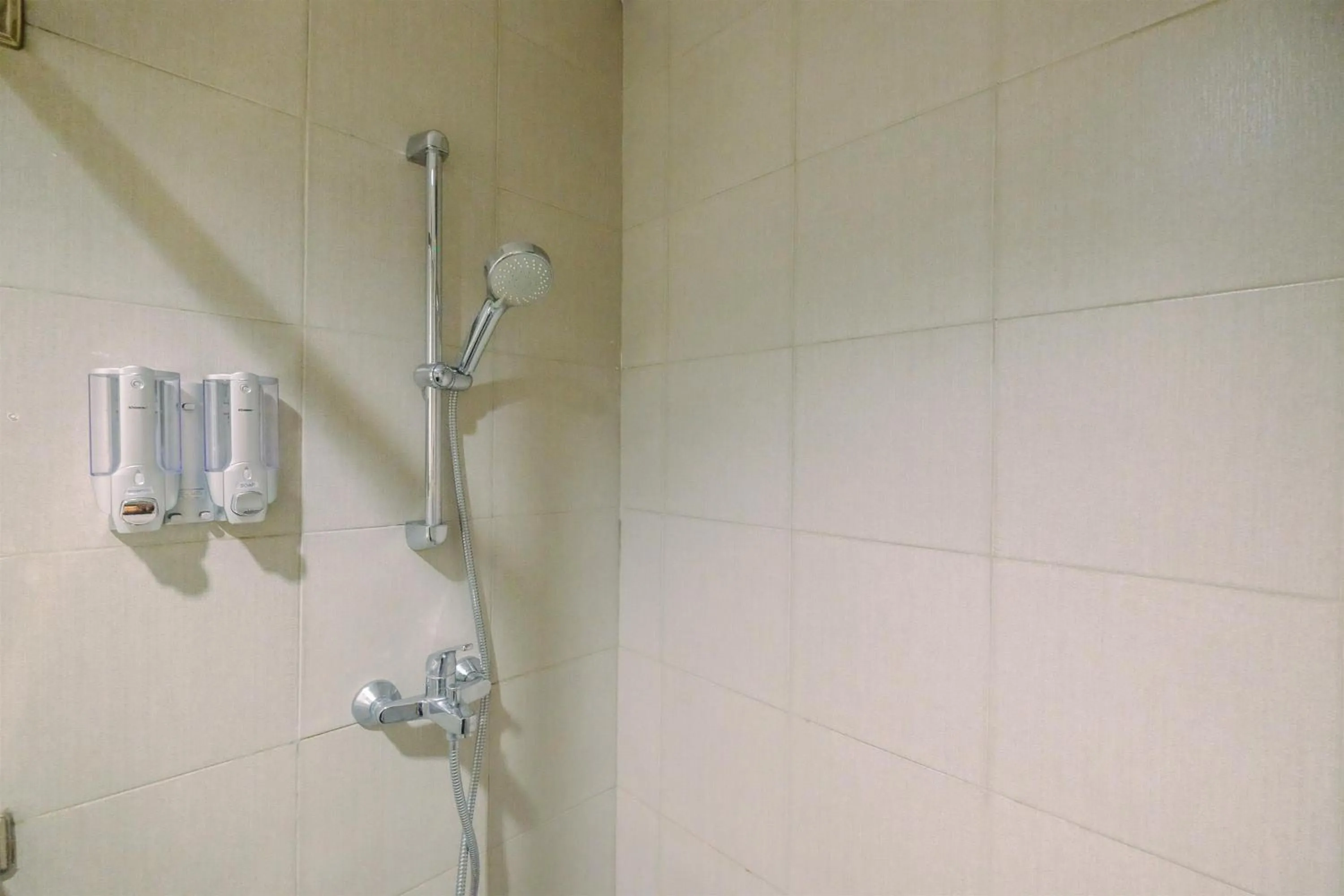 Bathroom in Minimalist Studio at 11st Floor Bogor Icon Apartment By Travelio