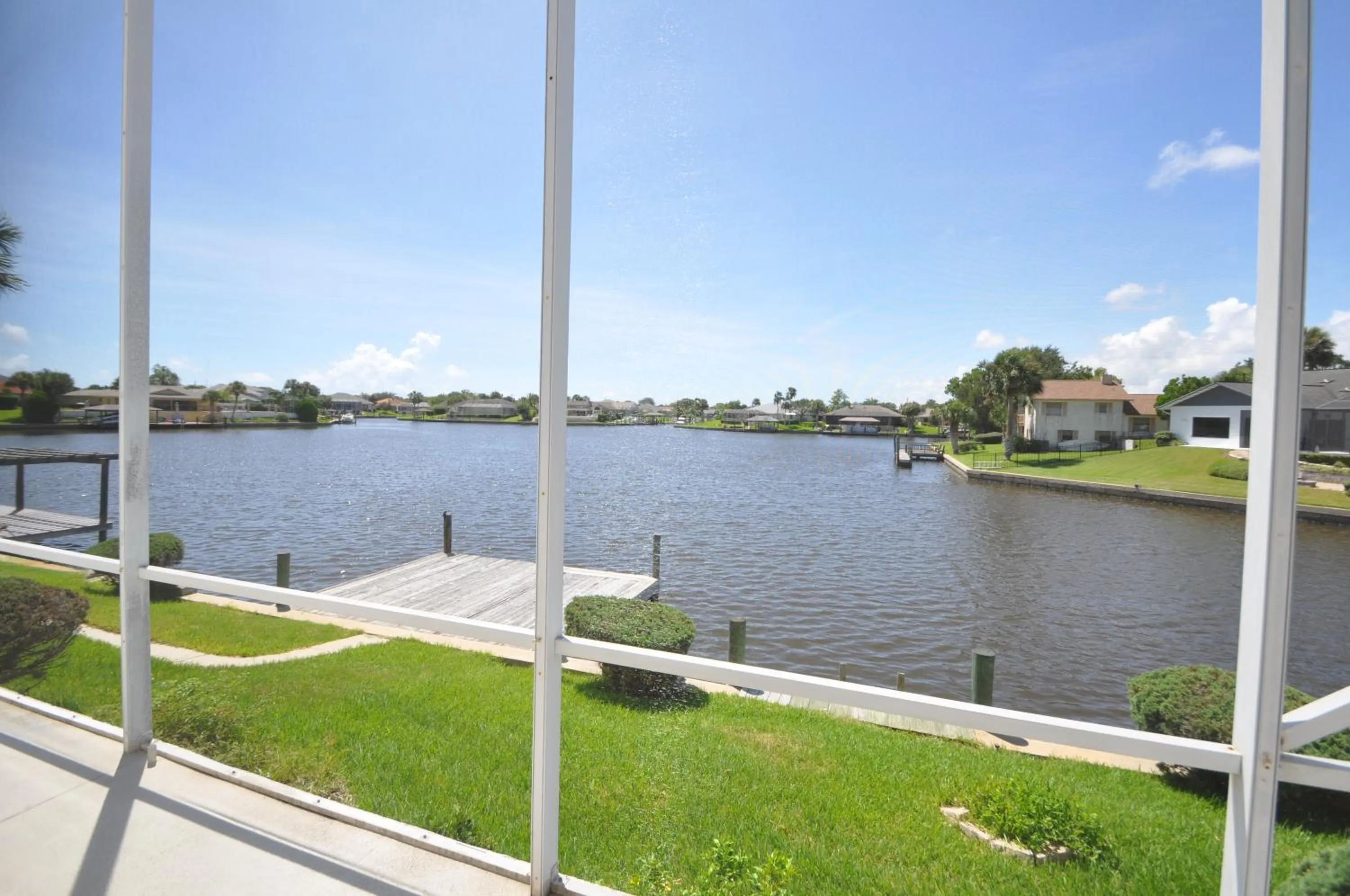 Sunset Bay Beautiful Pool Home - Bring Your Boat or Jet Ski - Canal with Dock- Sleeps 10 - 4 BD